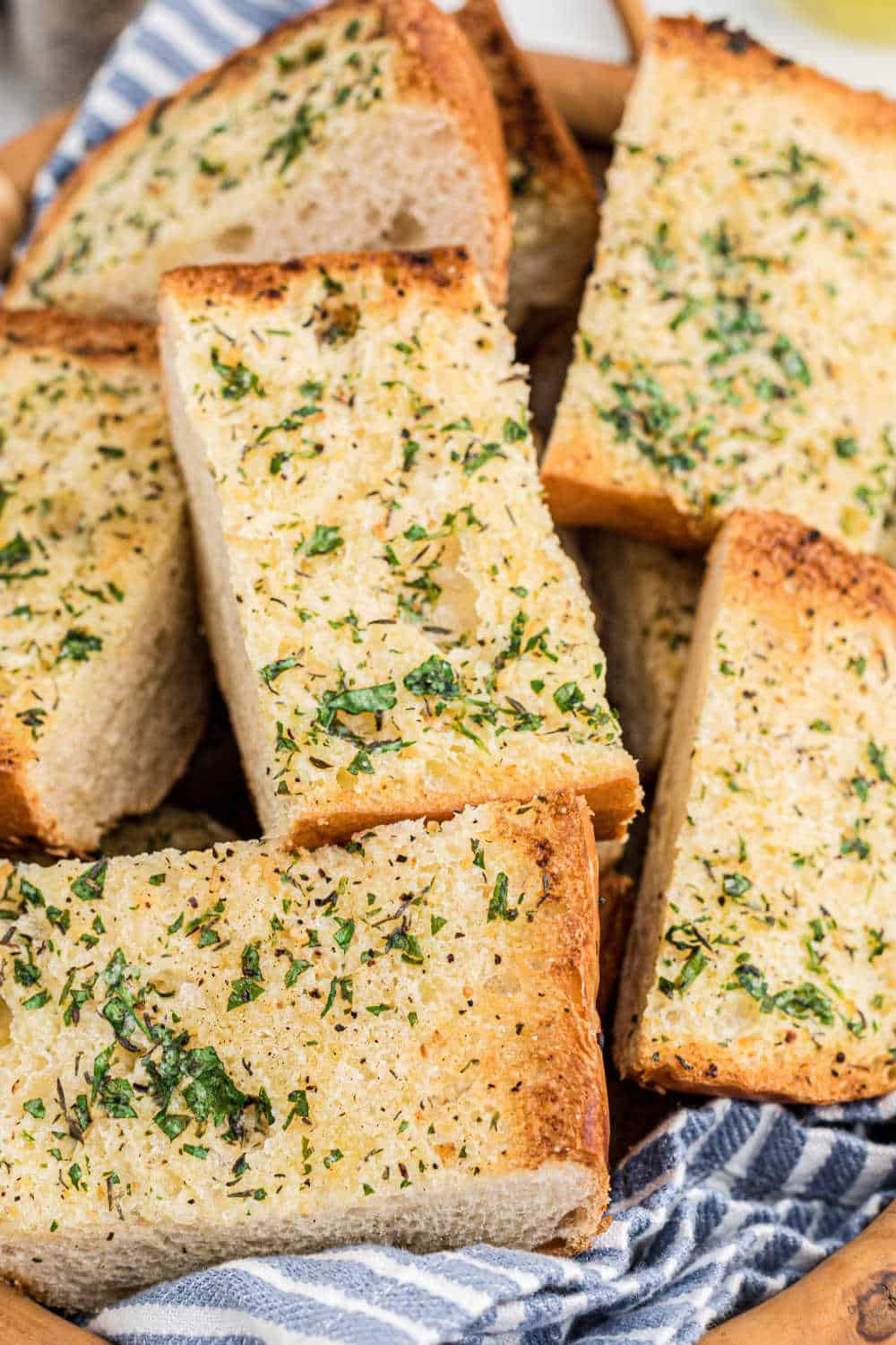 Pieces of garlic bread in a basket.