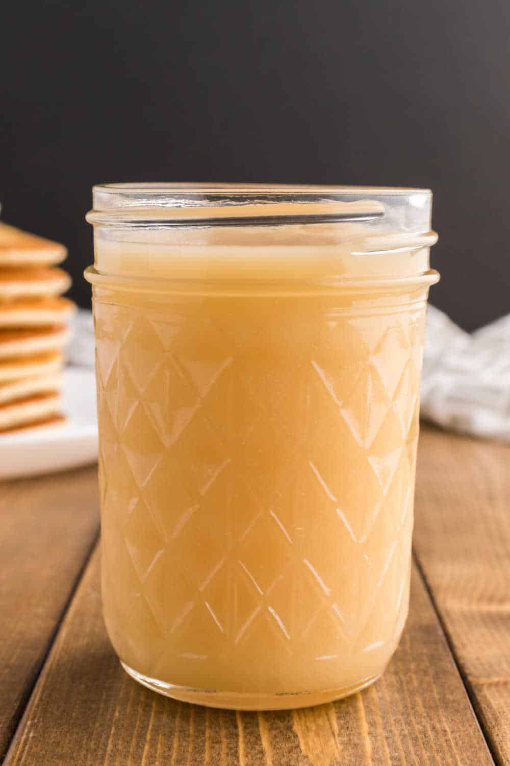 A mason jar of homemade pancake syrup.