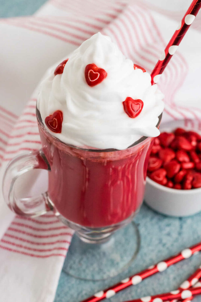 A mug of the recipe with a red straw.