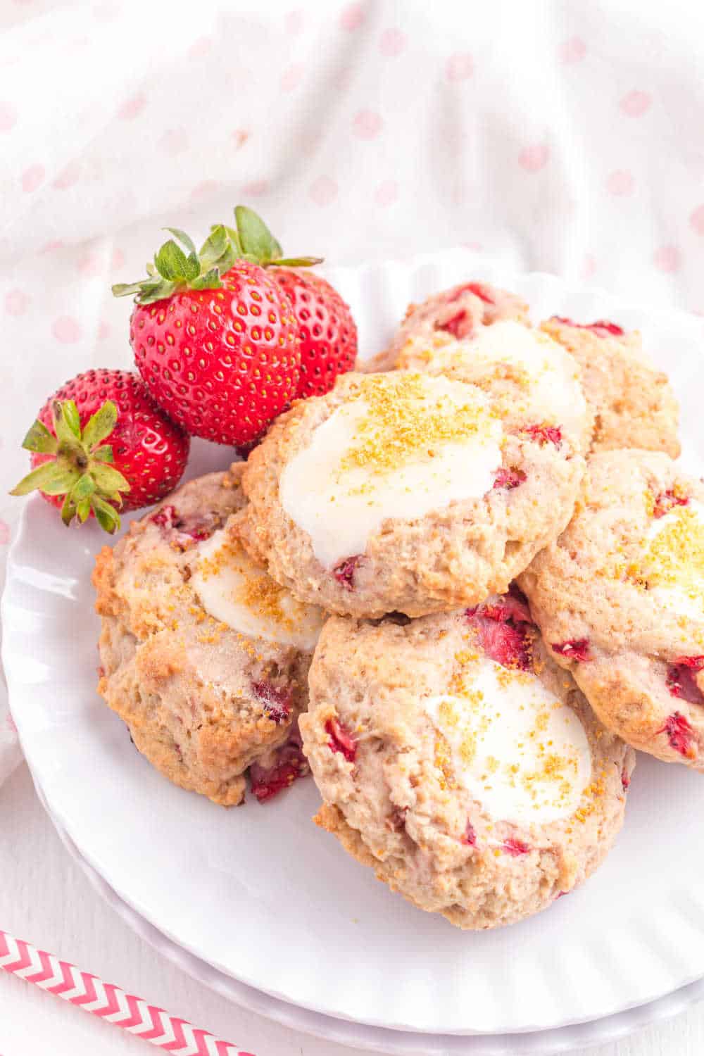 Strawberry cheesecake cookies on a plate.