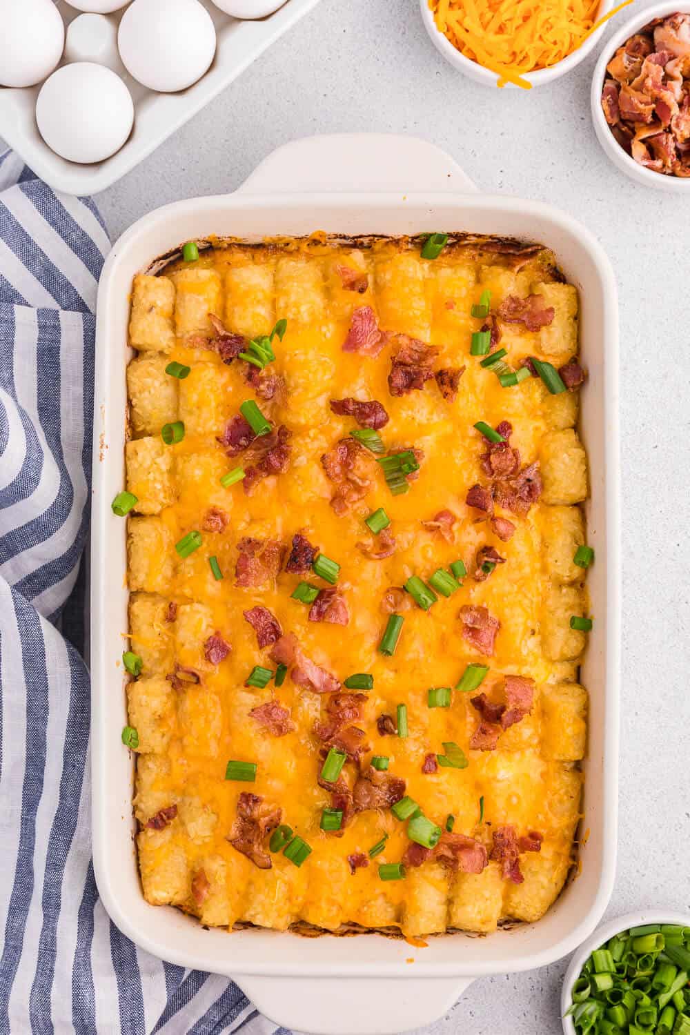 Tater tot breakfast casserole in a baking dish.