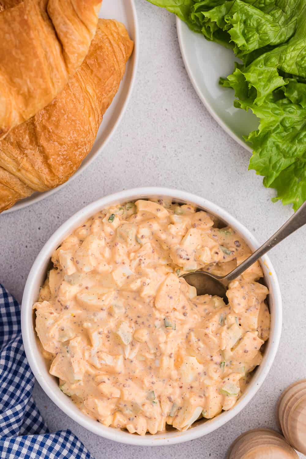 Egg salad in a bowl with a spoon.