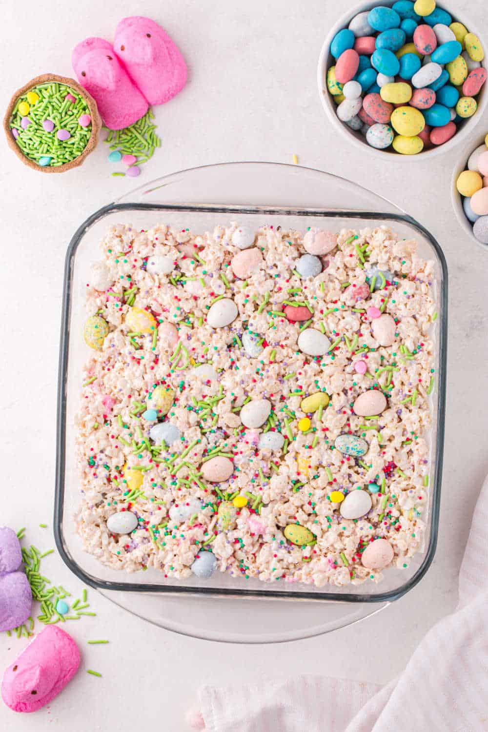 A glass pan of easter candy rice krispie treats.