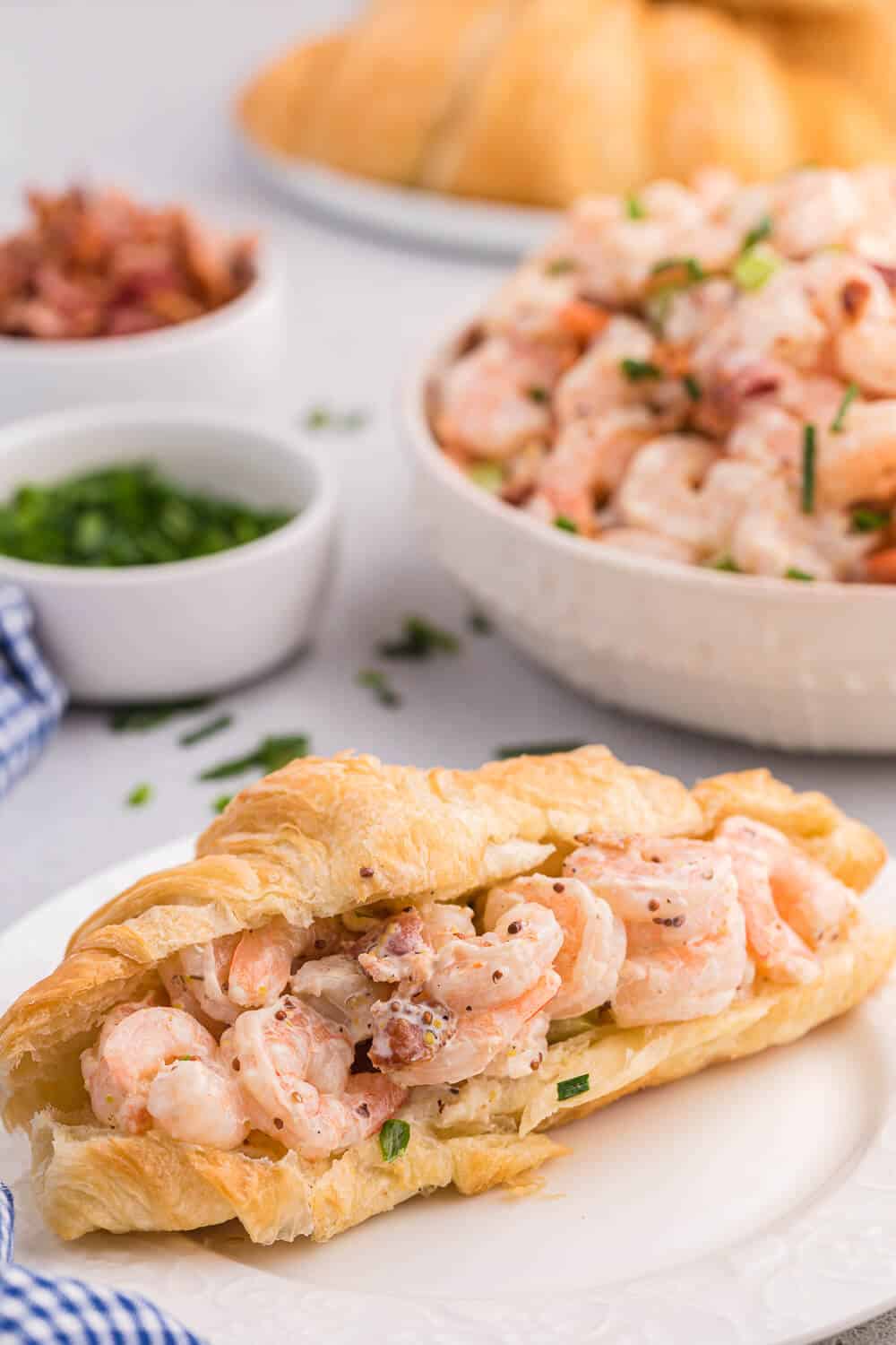 Shrimp salad on a croissant.