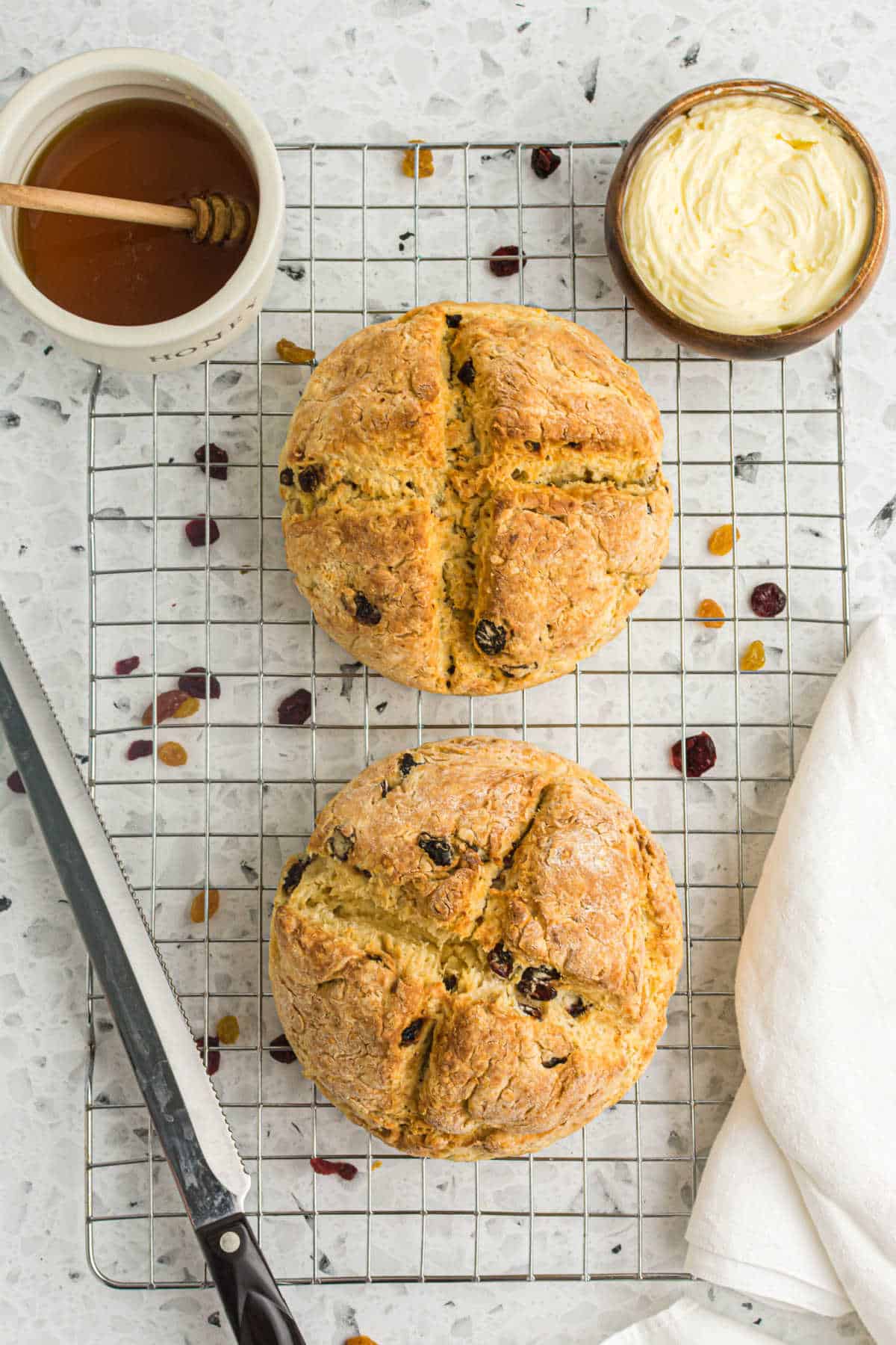 Two Irish Soda Breads on a wire rack.