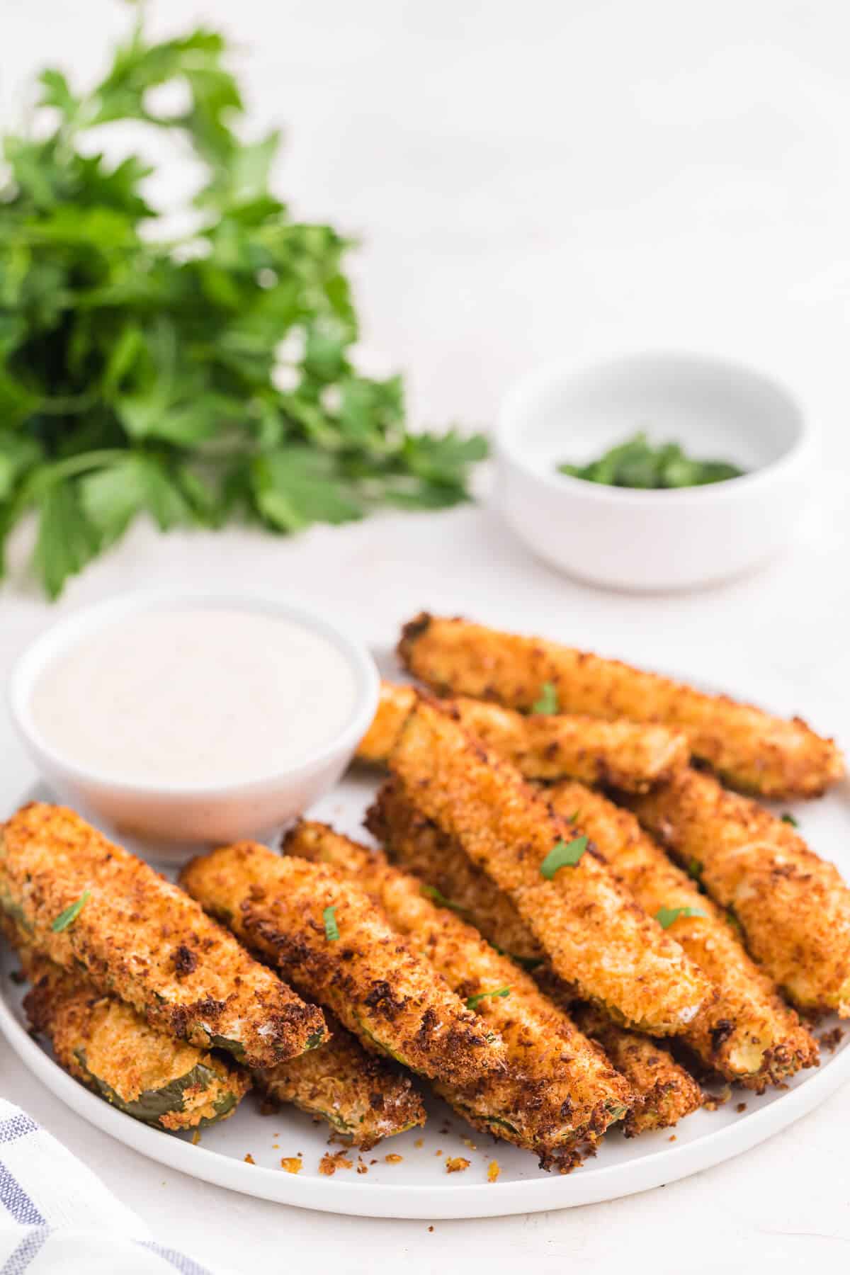 Air fryer fried pickles on a plate.