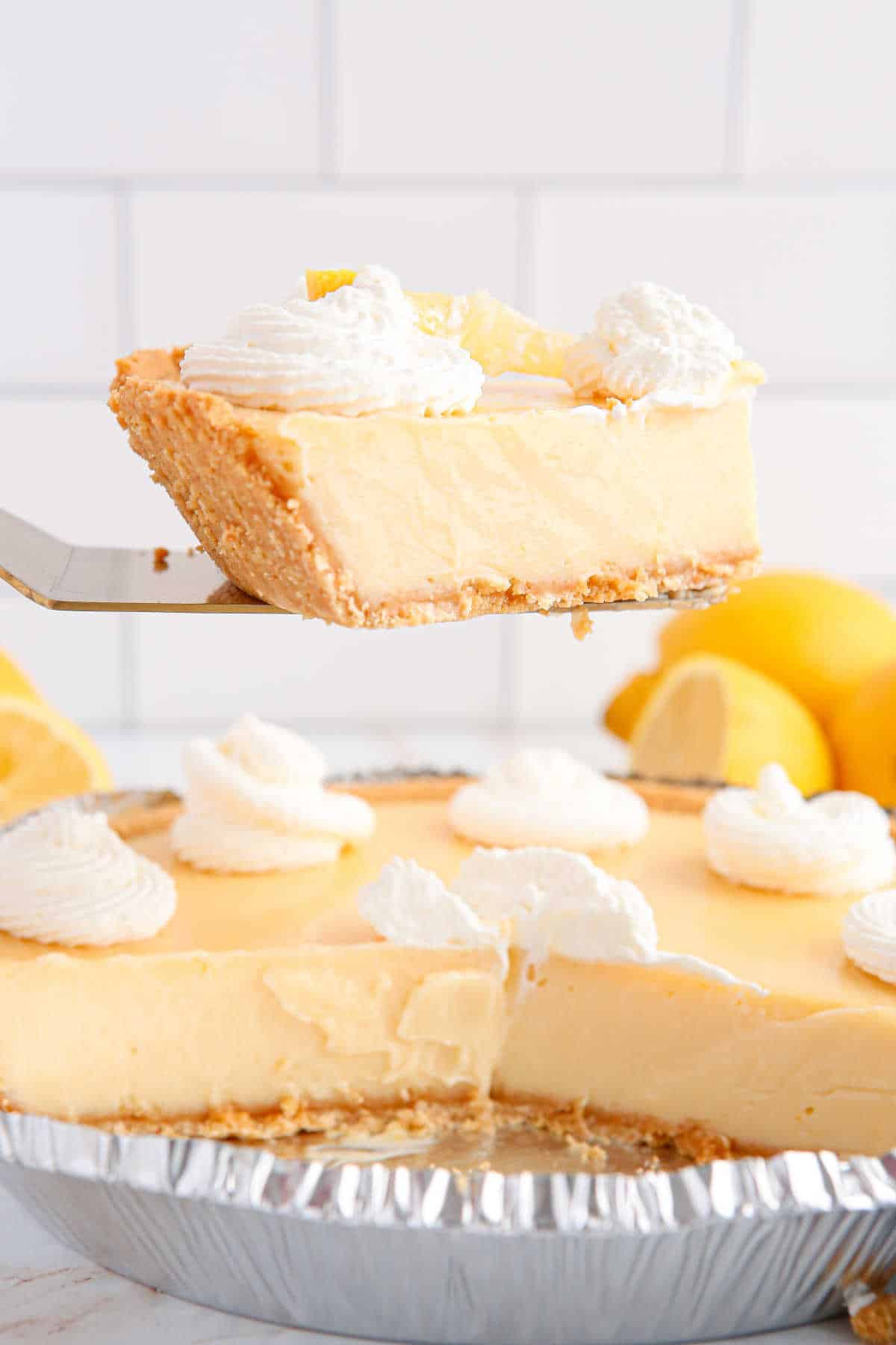 Classic lemon pie slice on a pie server.