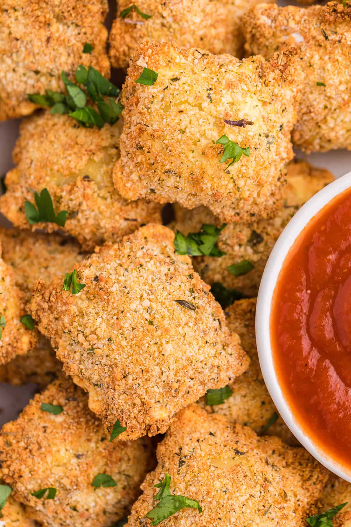 Close up of air fryer fried ravioli.