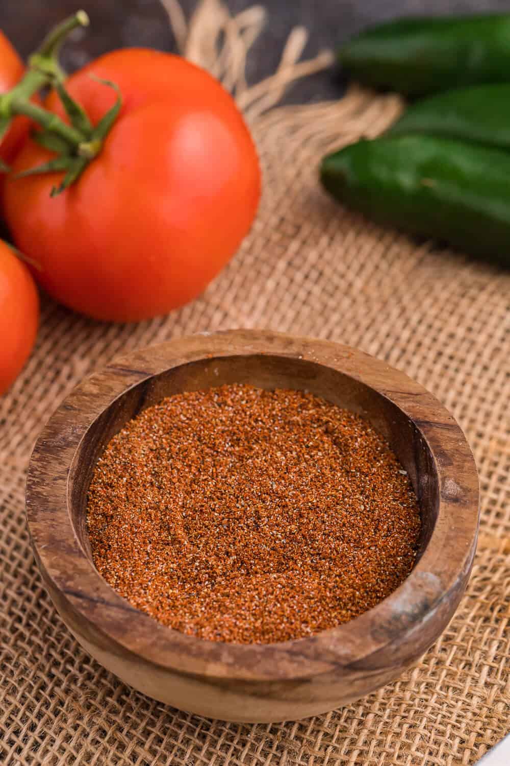 Taco seasoning in a wooden bowl.