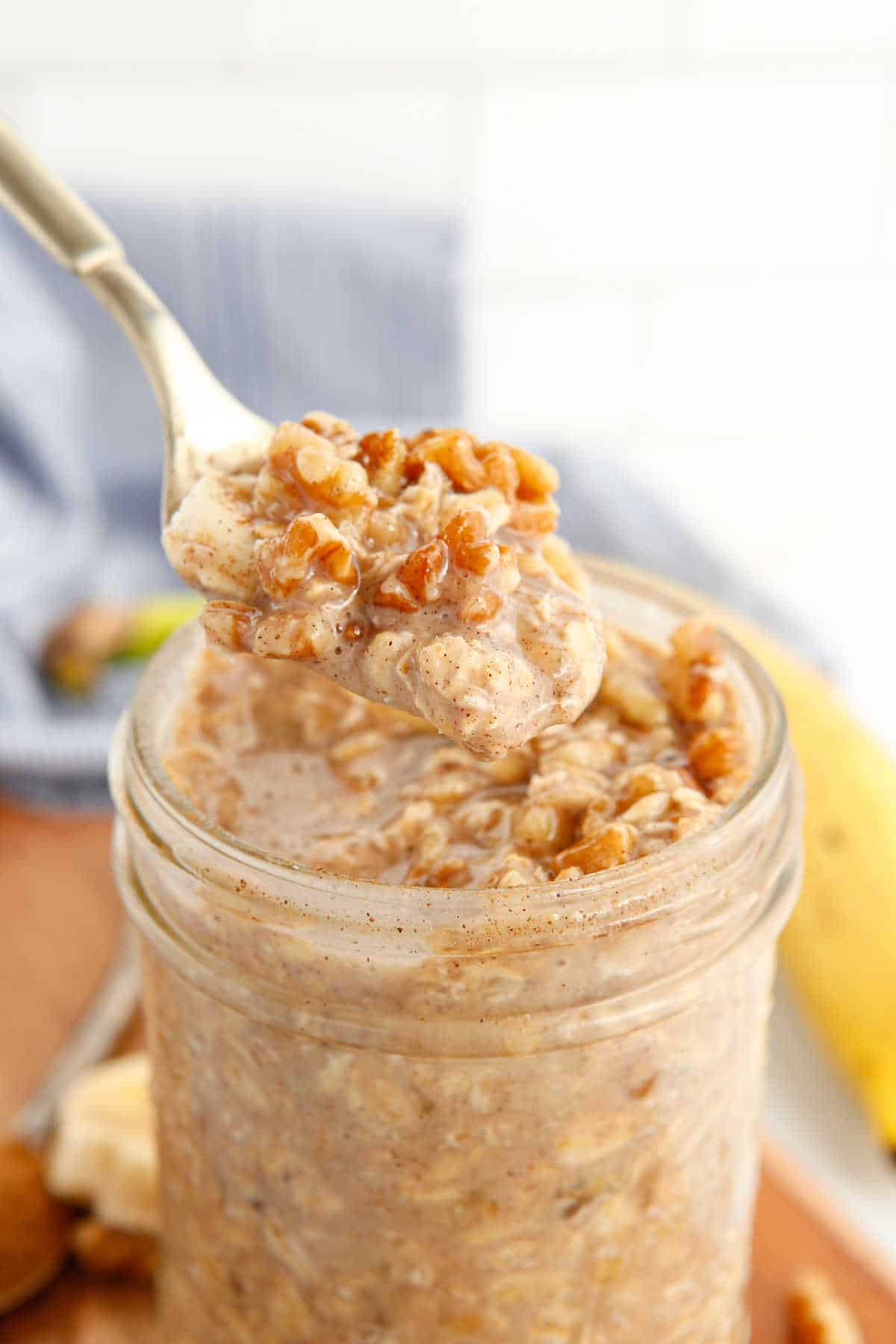 A spoon with banana bread overnight oats.