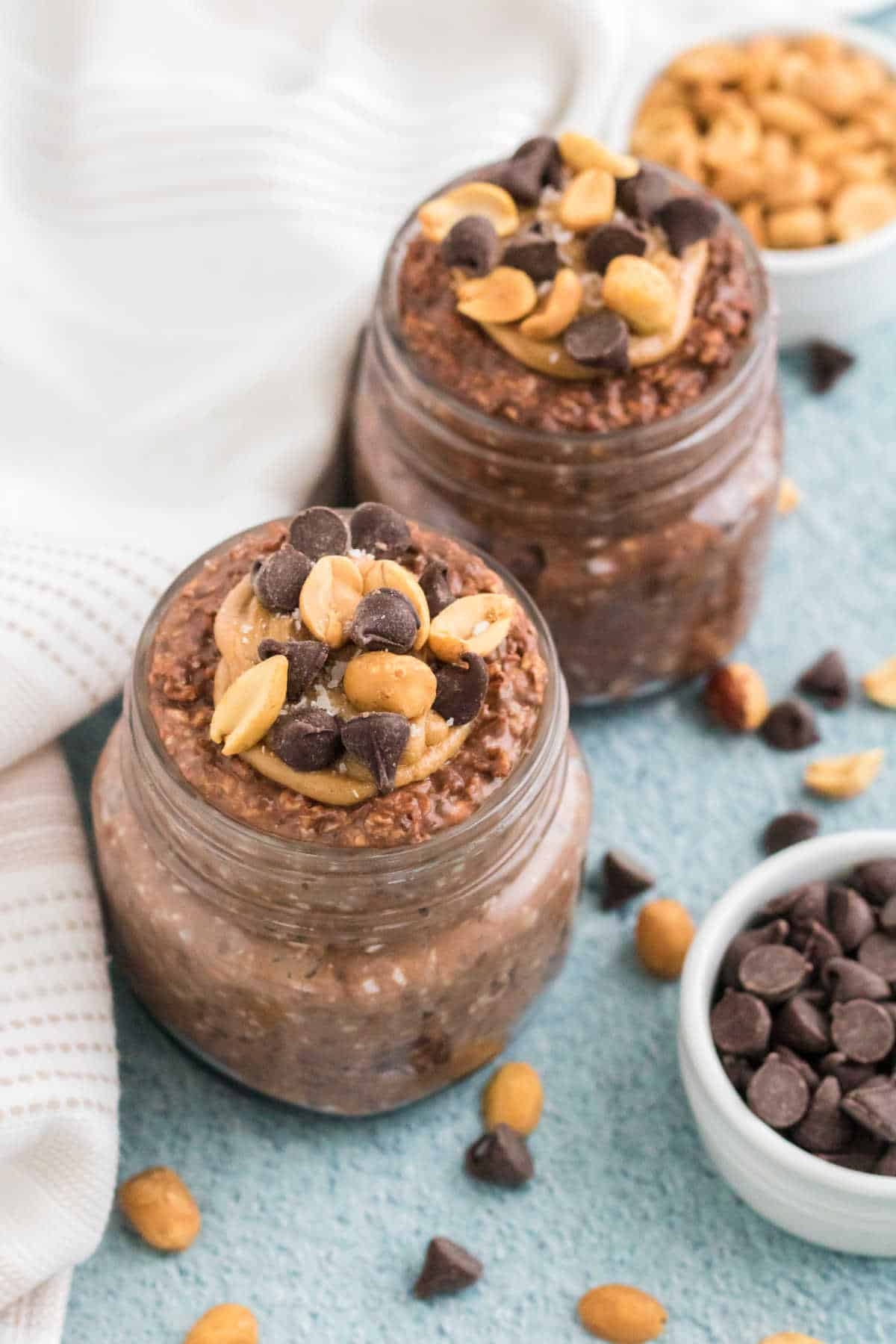 Chocolate peanut butter overnight oats in mason jars.