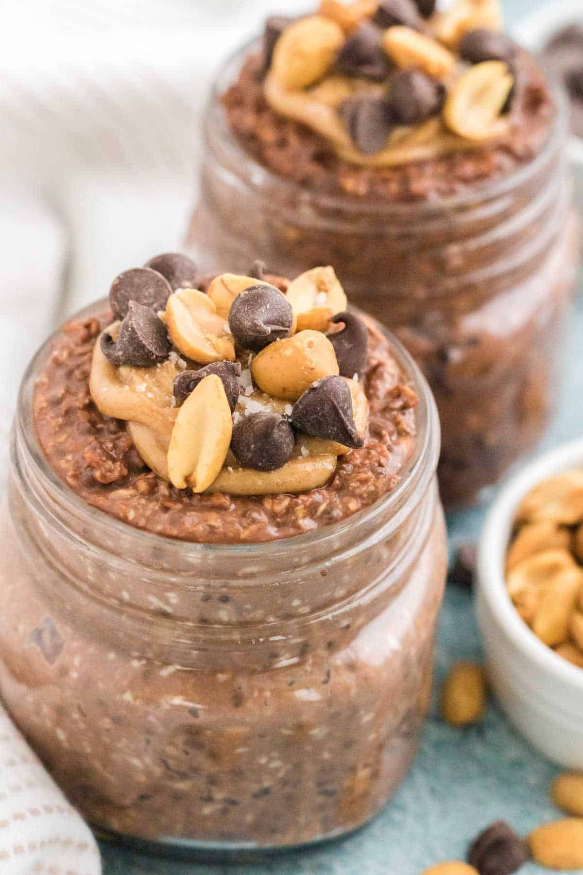 Chocolate peanut butter overnight oats in mason jars.