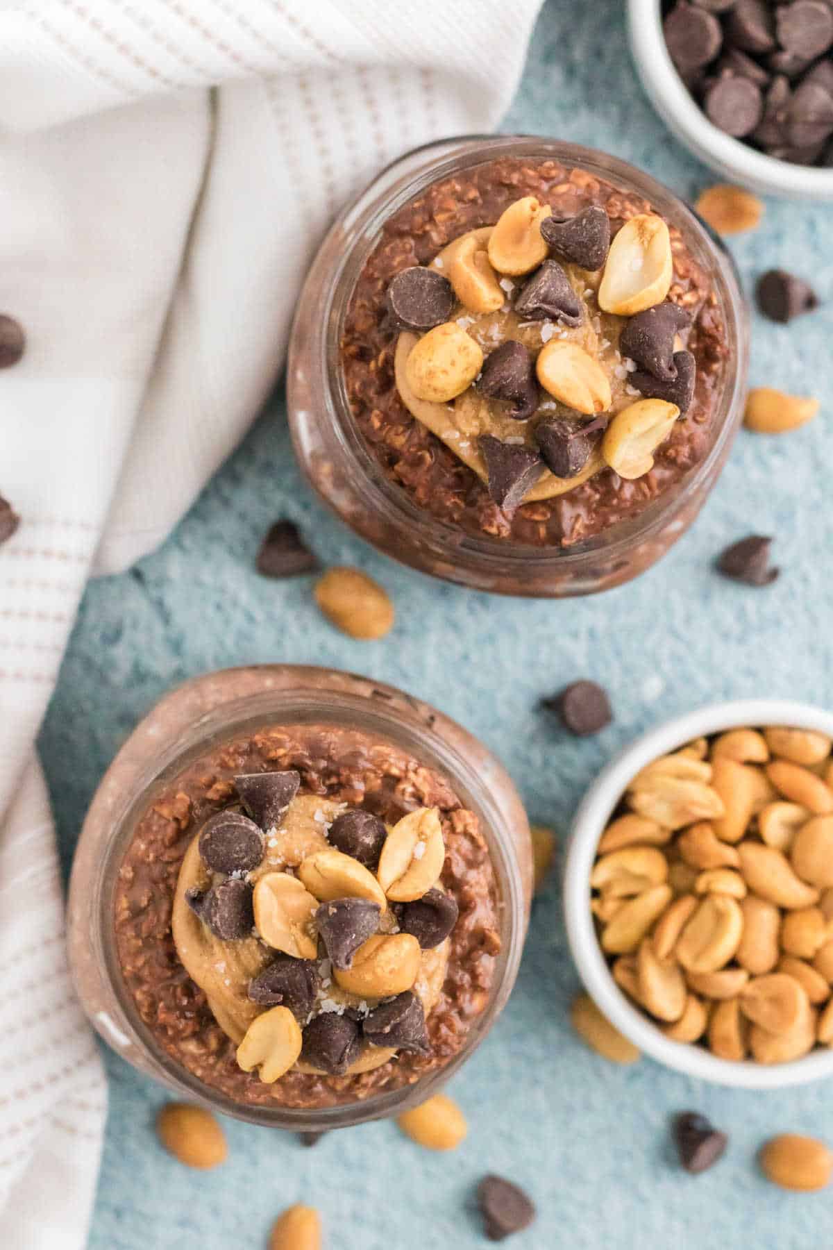 Chocolate peanut butter overnight oats in mason jars. 