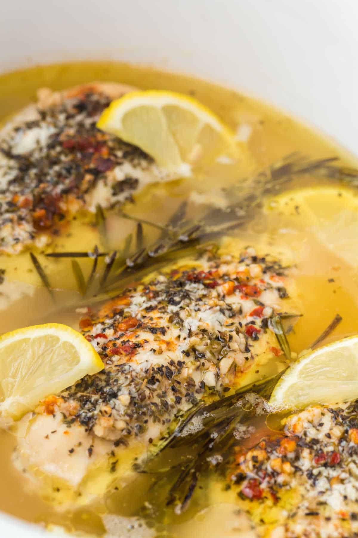 Lemon garlic butter chicken in a slow cooker.