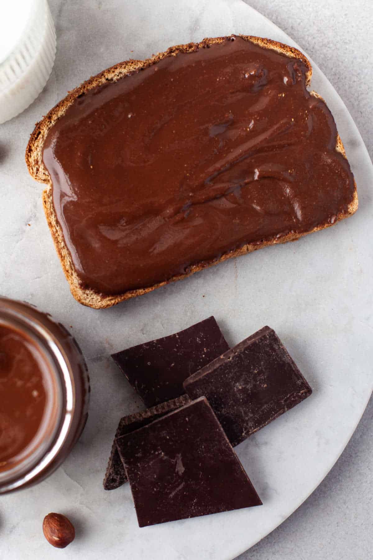 Nutella spread on a piece of toast.