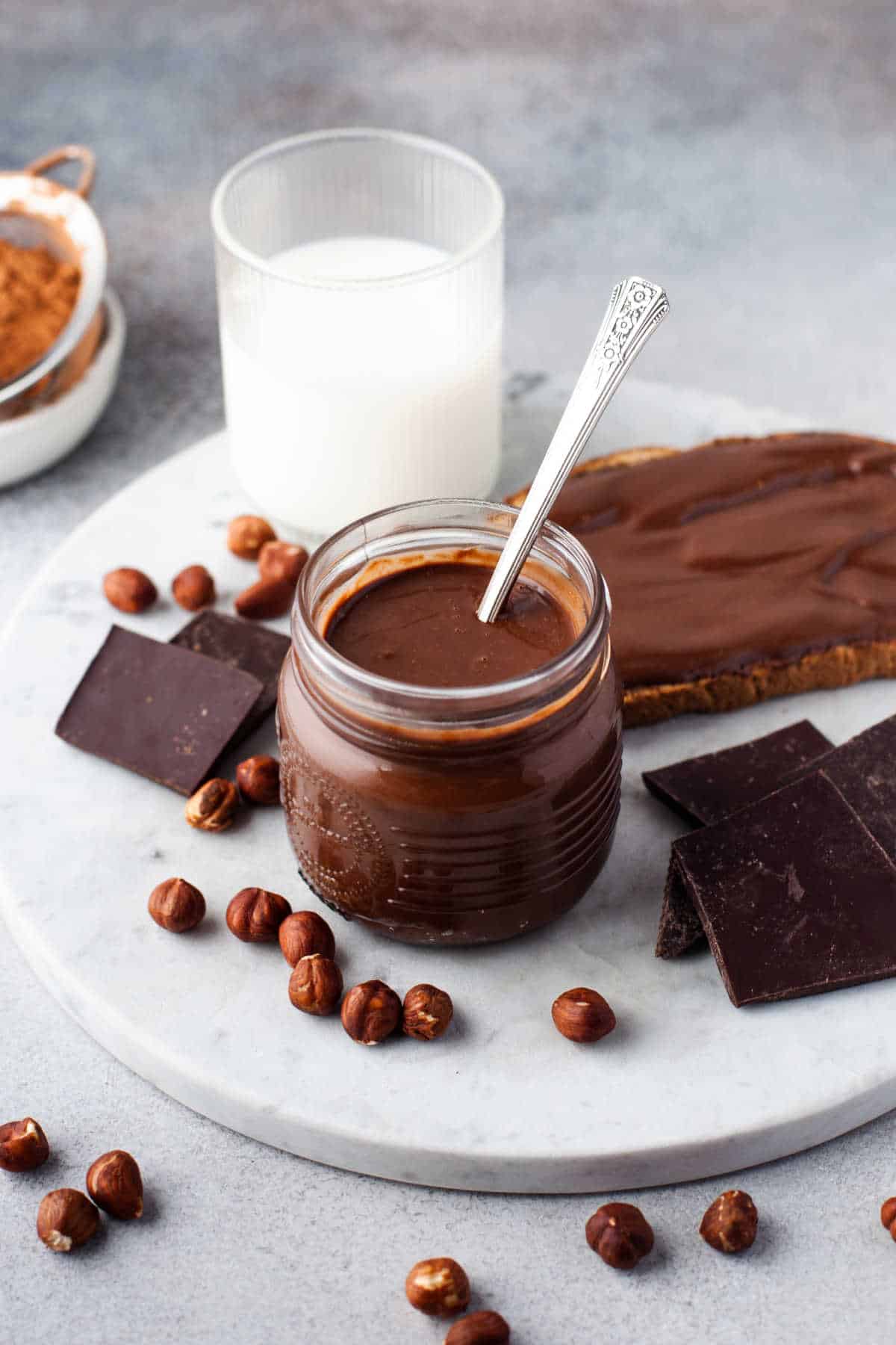 Nutella in a jar with a spoon.