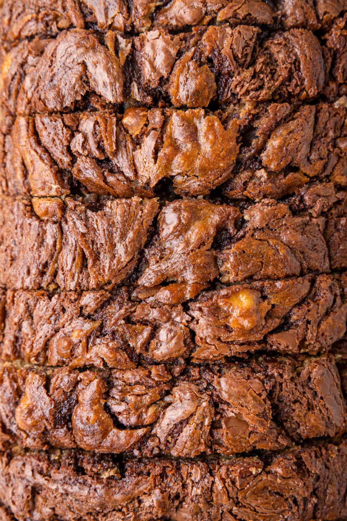 View of a loaf of Nutella banana bread from the top with slice cuts.