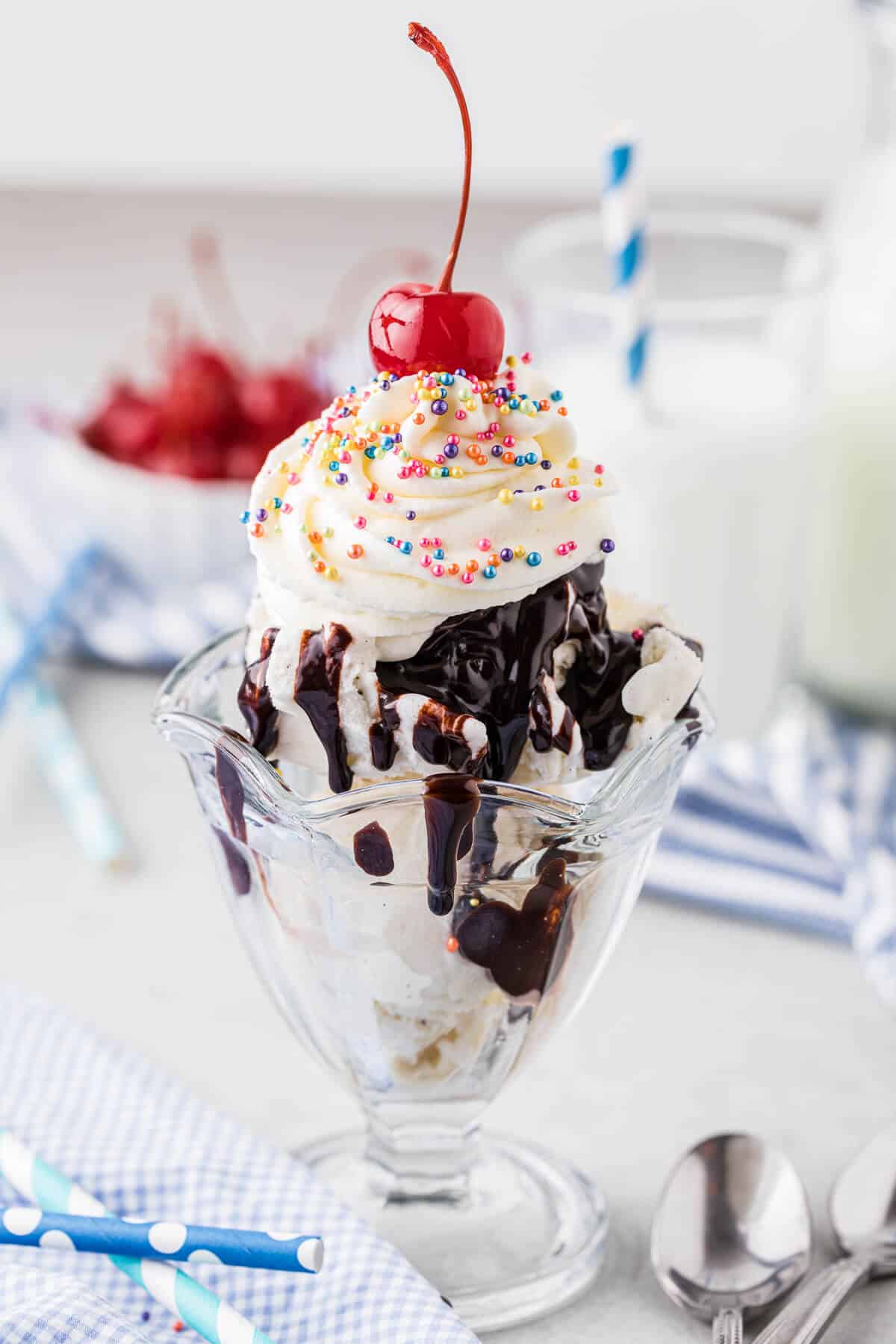 Stabilized whipped cream on top of a chocolate sundae.