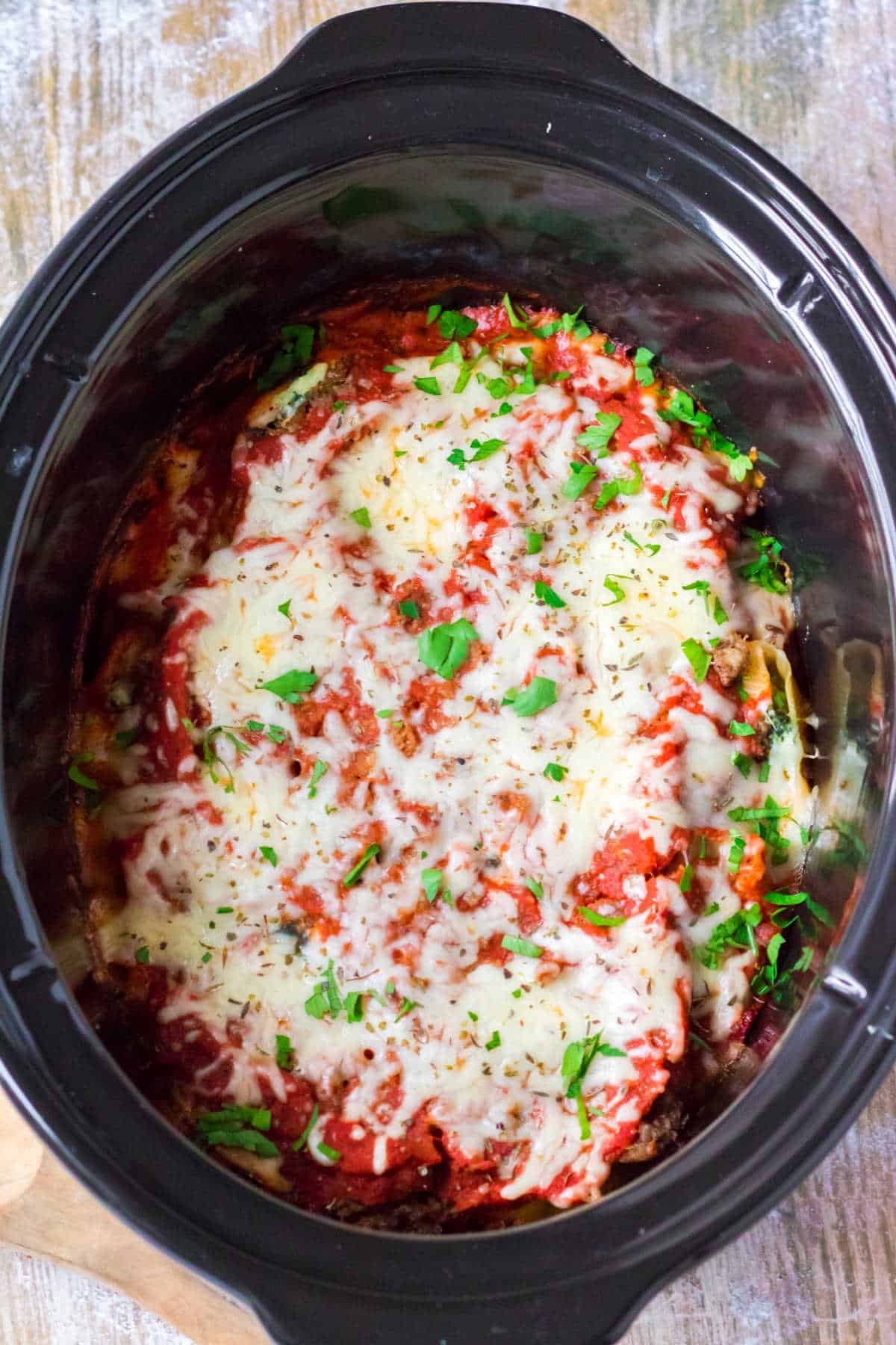 A crockpot with stuffed shells.