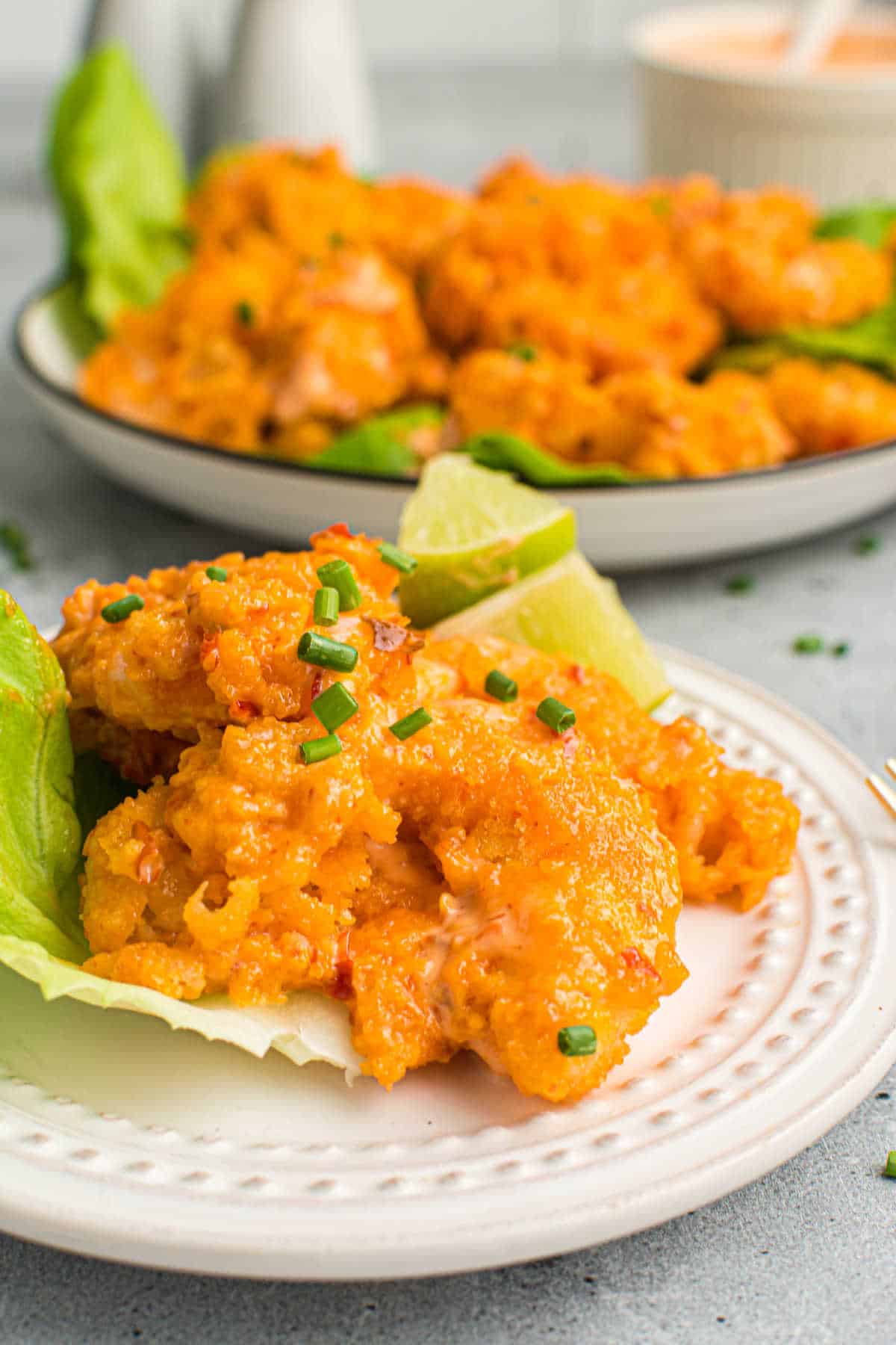 Air fryer bang bang shrimp on a plate.