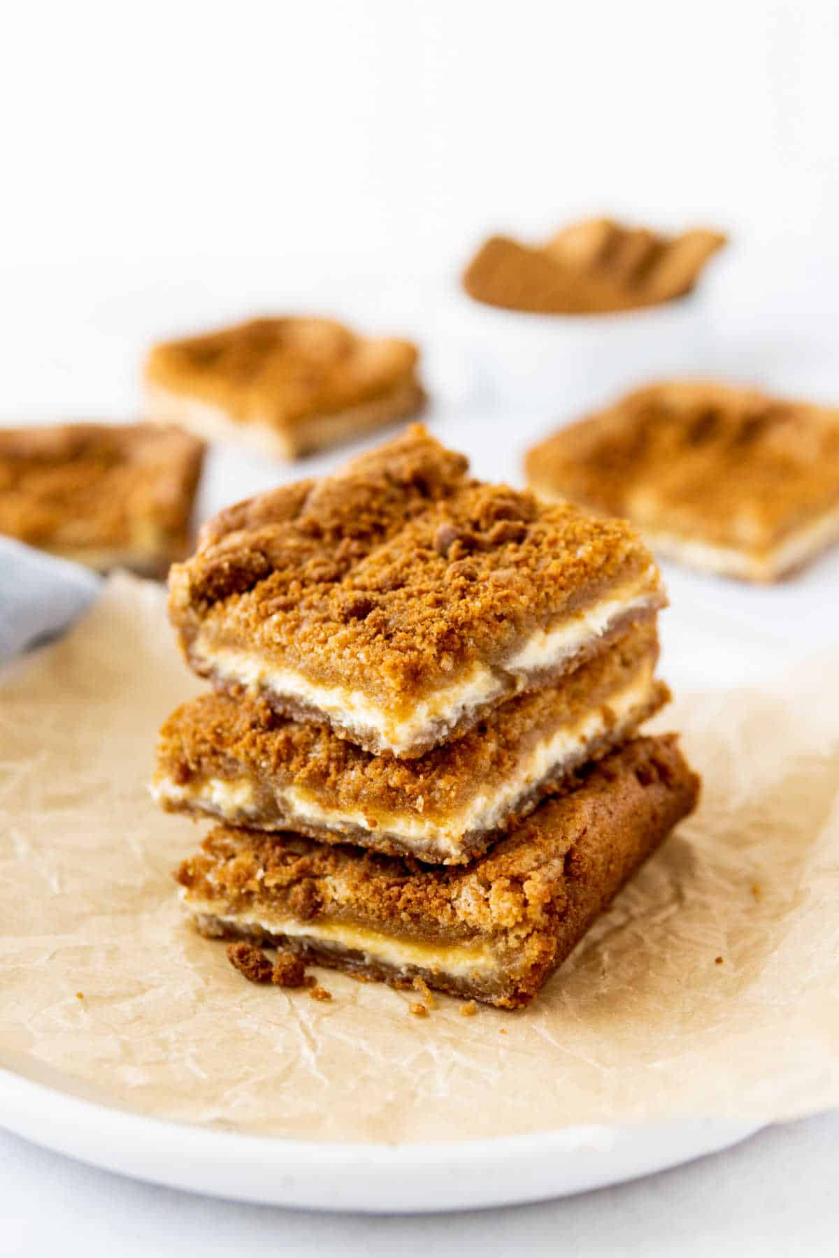 A stack of 3 Biscoff blondies with white chocolate.