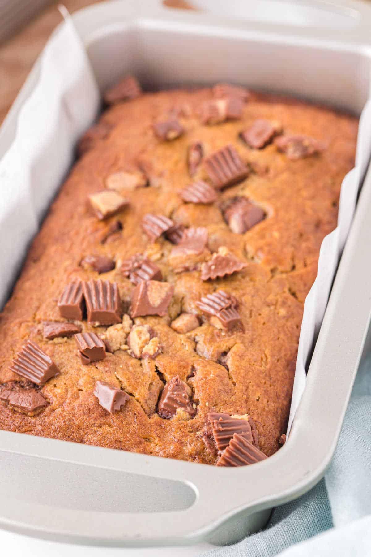 Reese's peanut butter banana bread in a loaf pan.