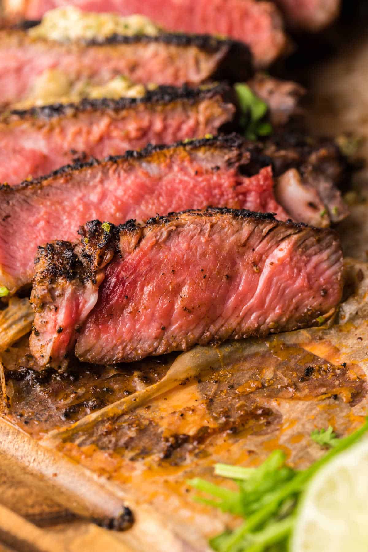 Blackened steak cut into thin slices.