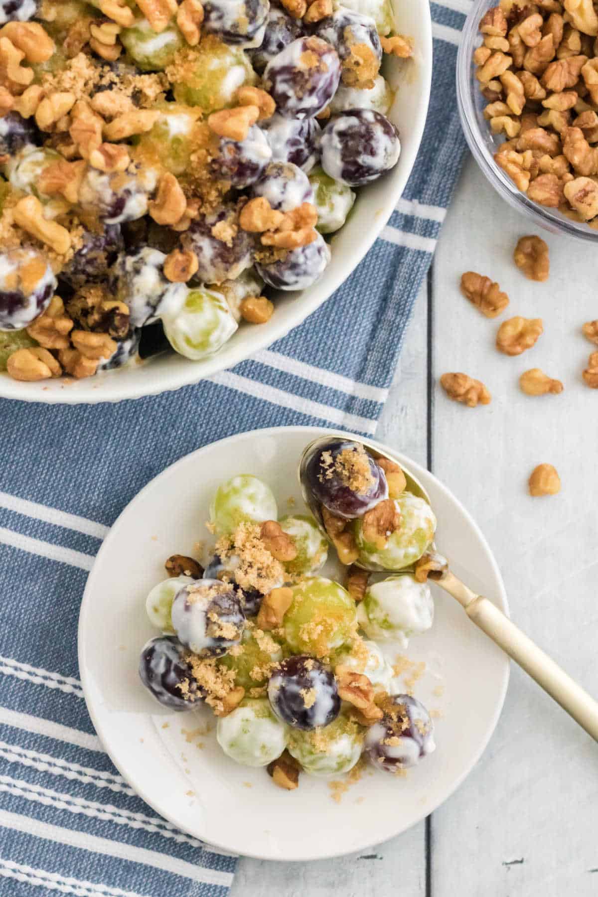 Grape salad on a plate with a spoon.