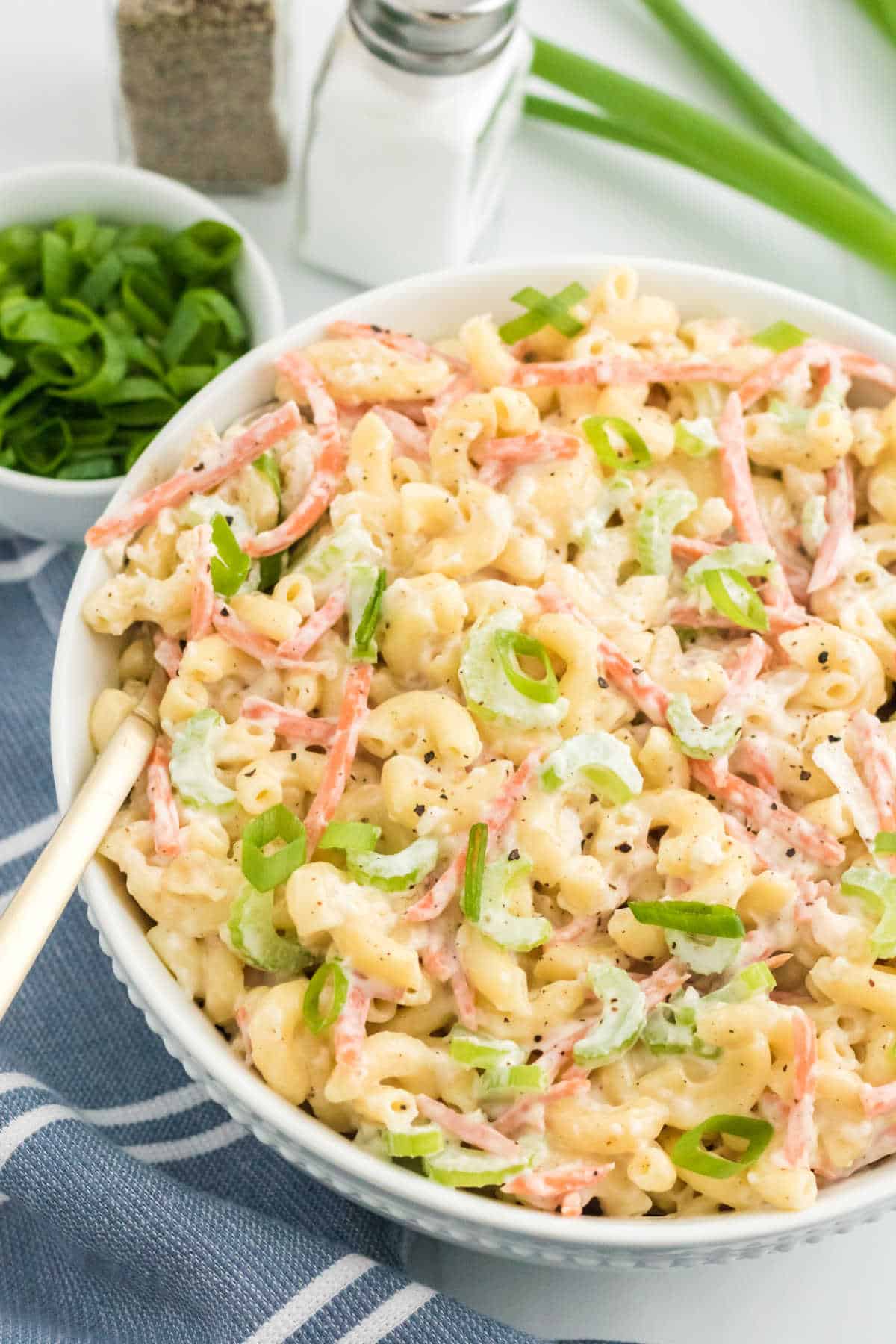 Hawaiian macaroni salad in a bowl with a spoon.