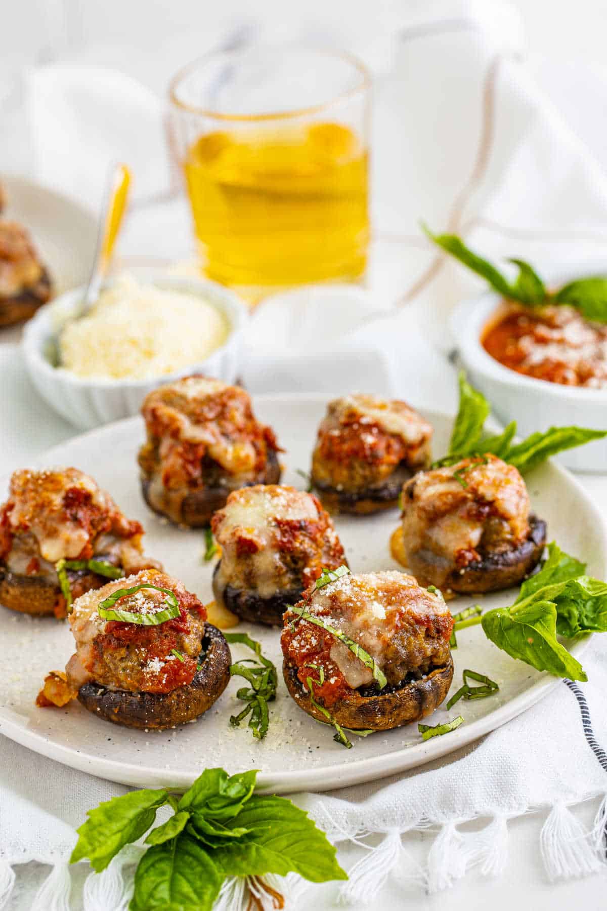 Meatball stuffed mushrooms on a plate.