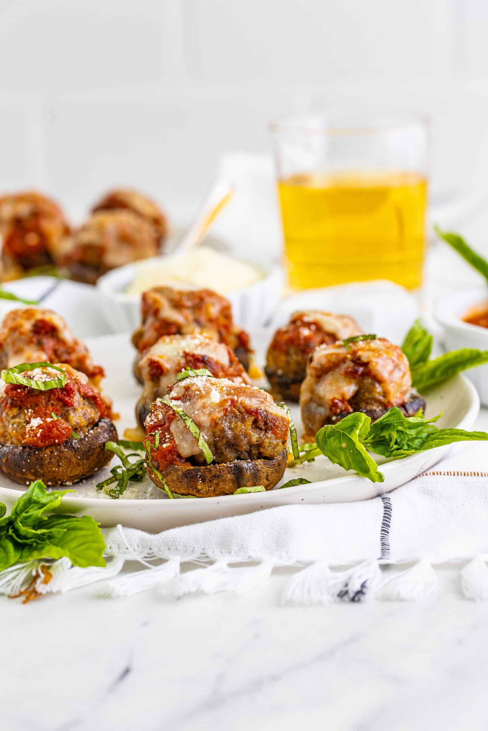 Meatball stuffed mushrooms on a plate.