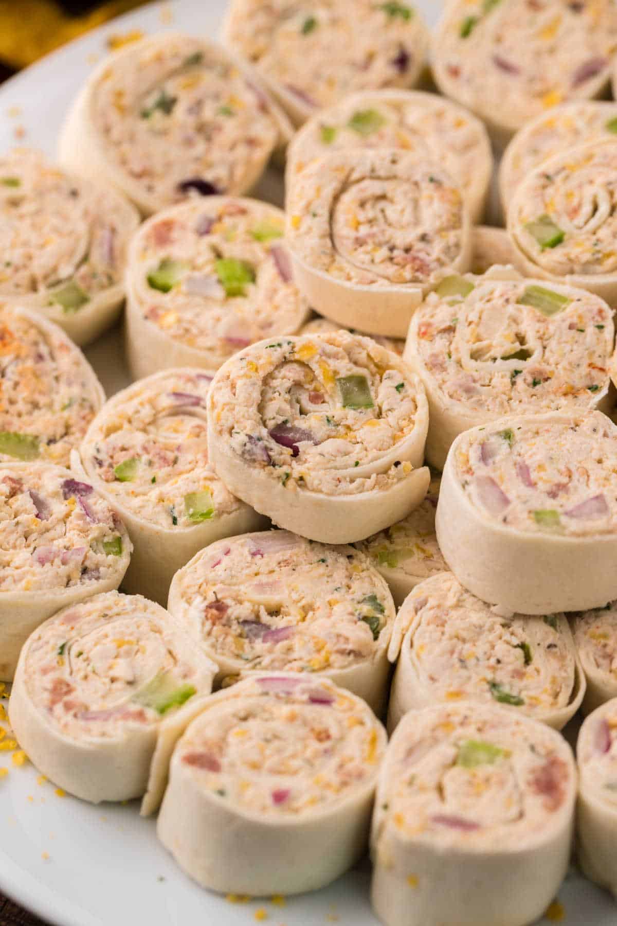 Chicken pinwheels on a plate.