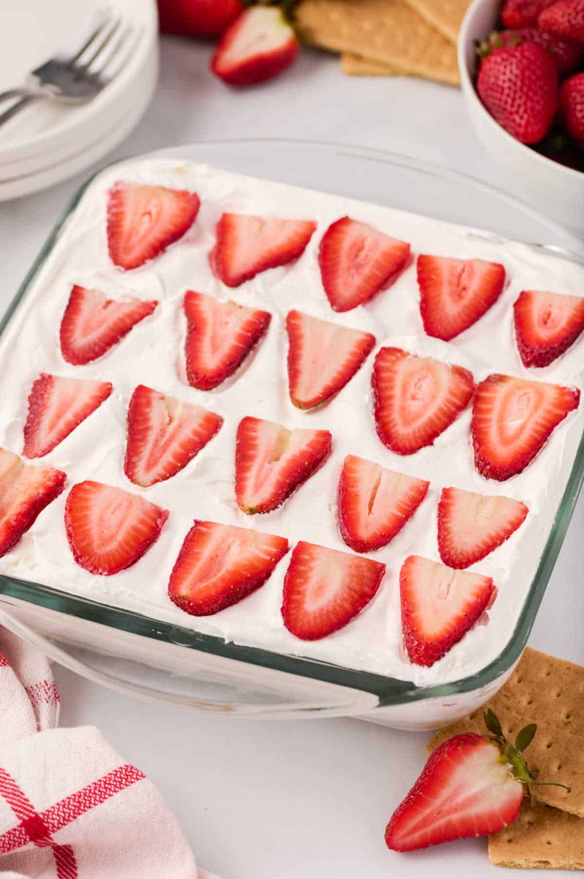 A pan of strawberry ice box cake.