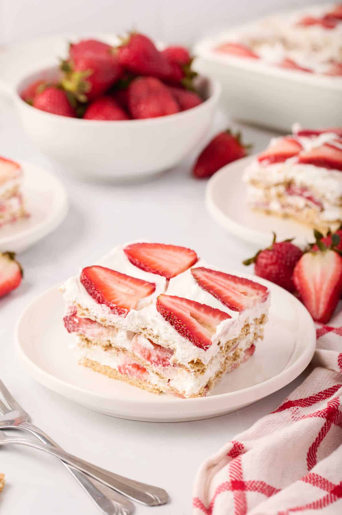 A slice of strawberry icebox cake on a plate.