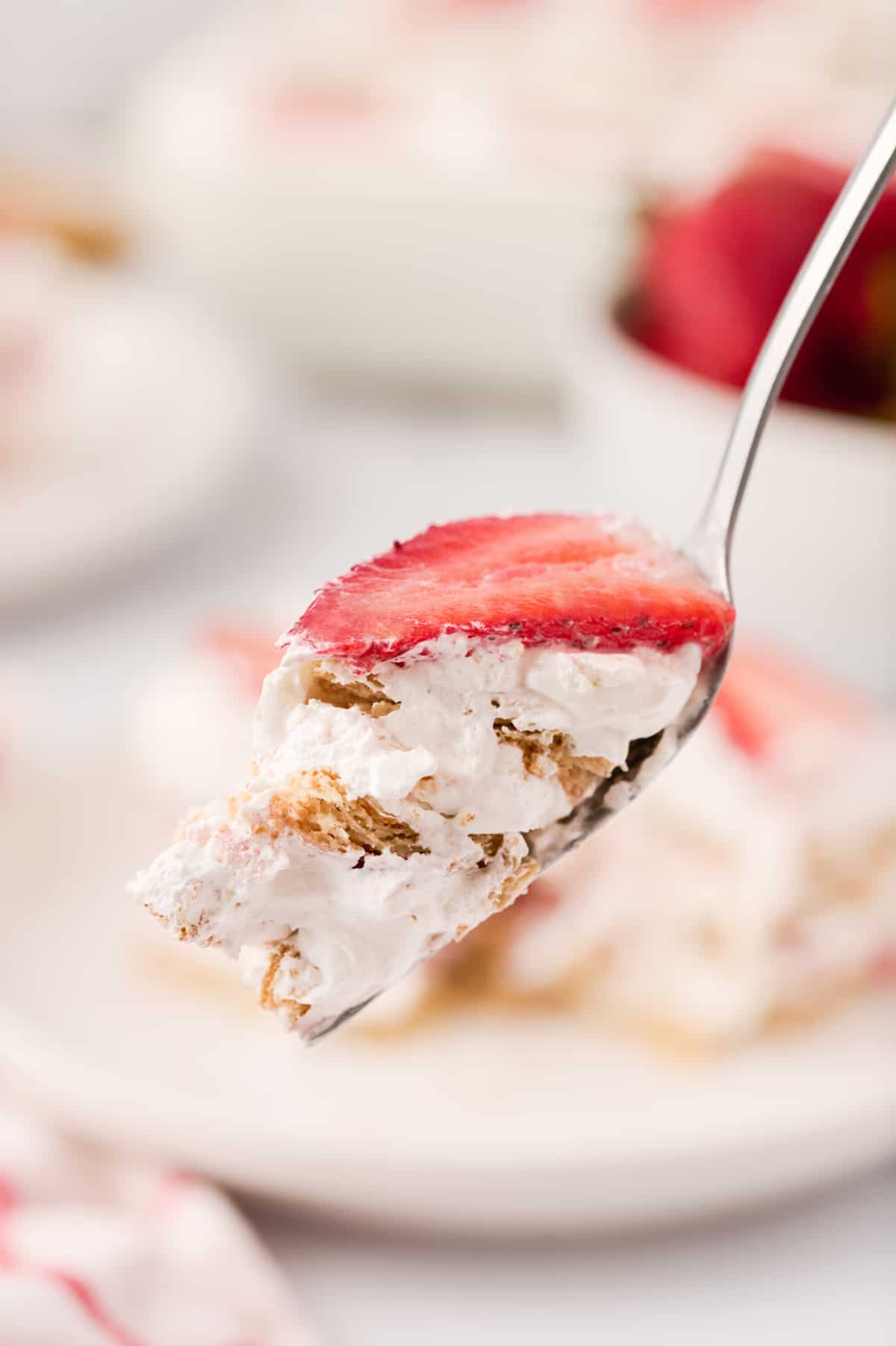 Strawberry icebox cake on a fork.