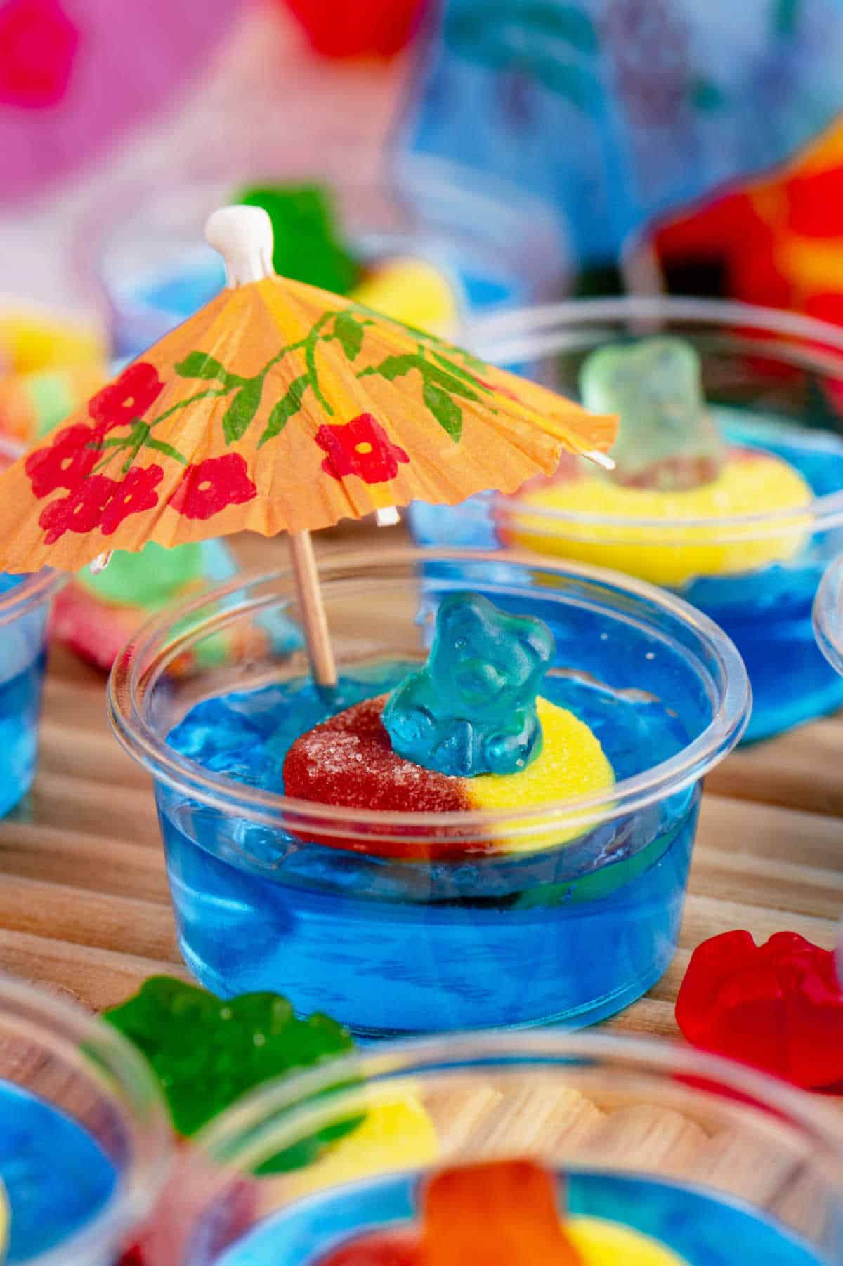 A pool party jello shot decorated with an umbrella.