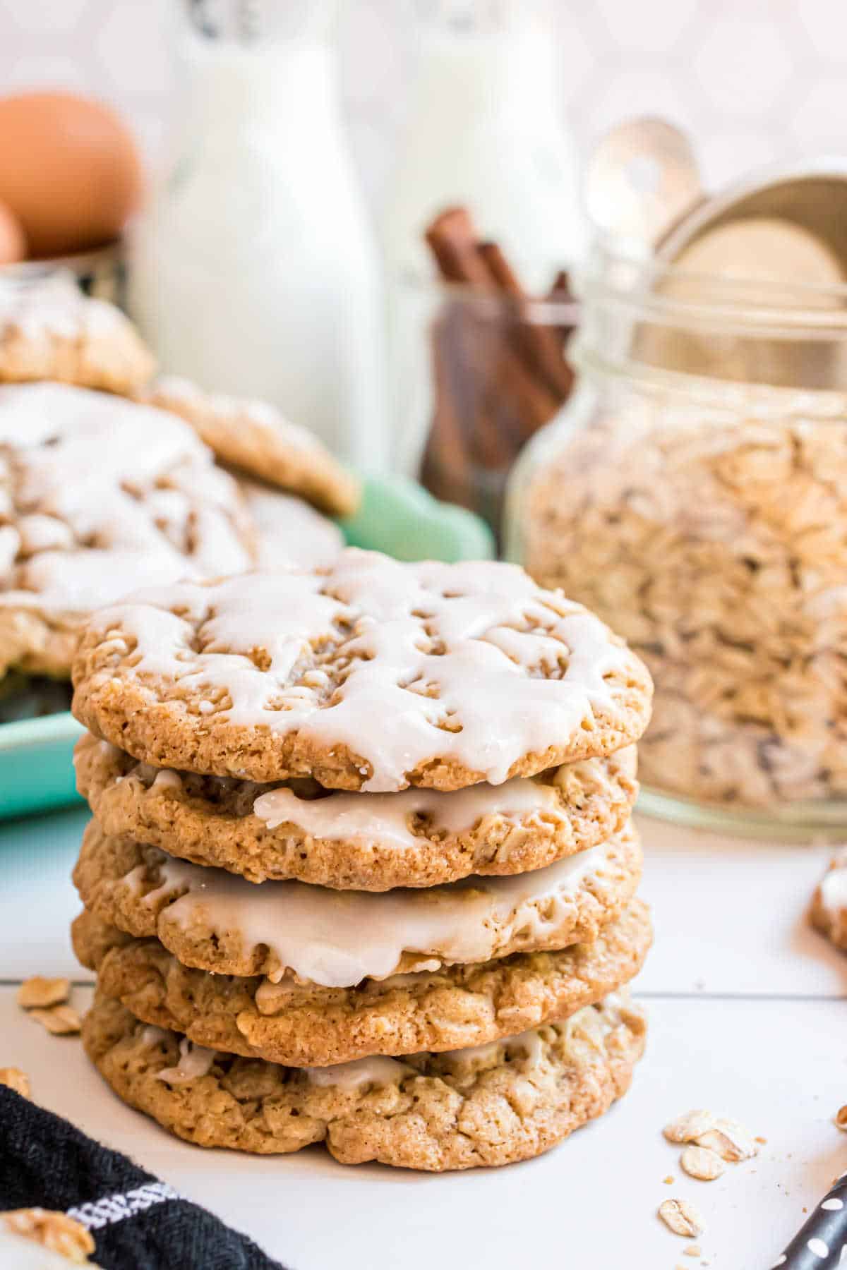 A stack of iced oatmeal cookies.