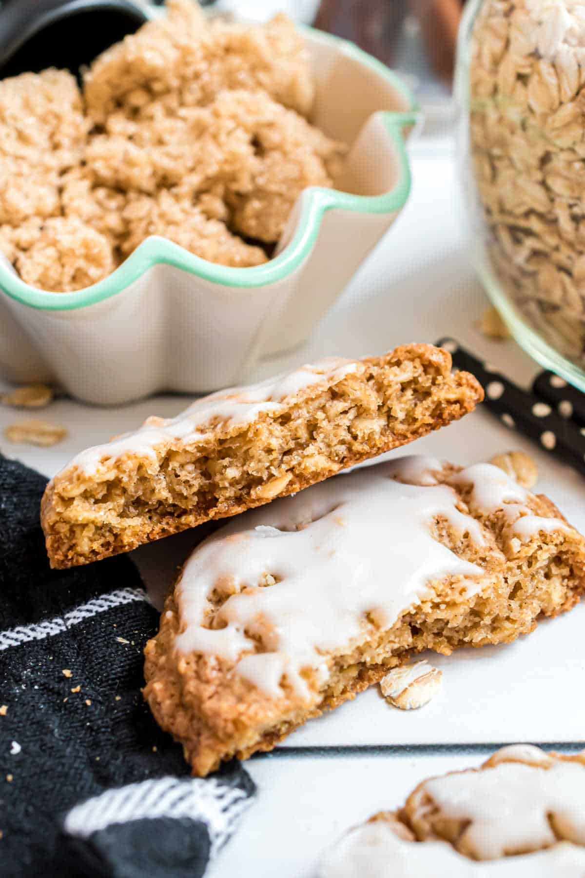 An iced oatmeal cookie broken in half.