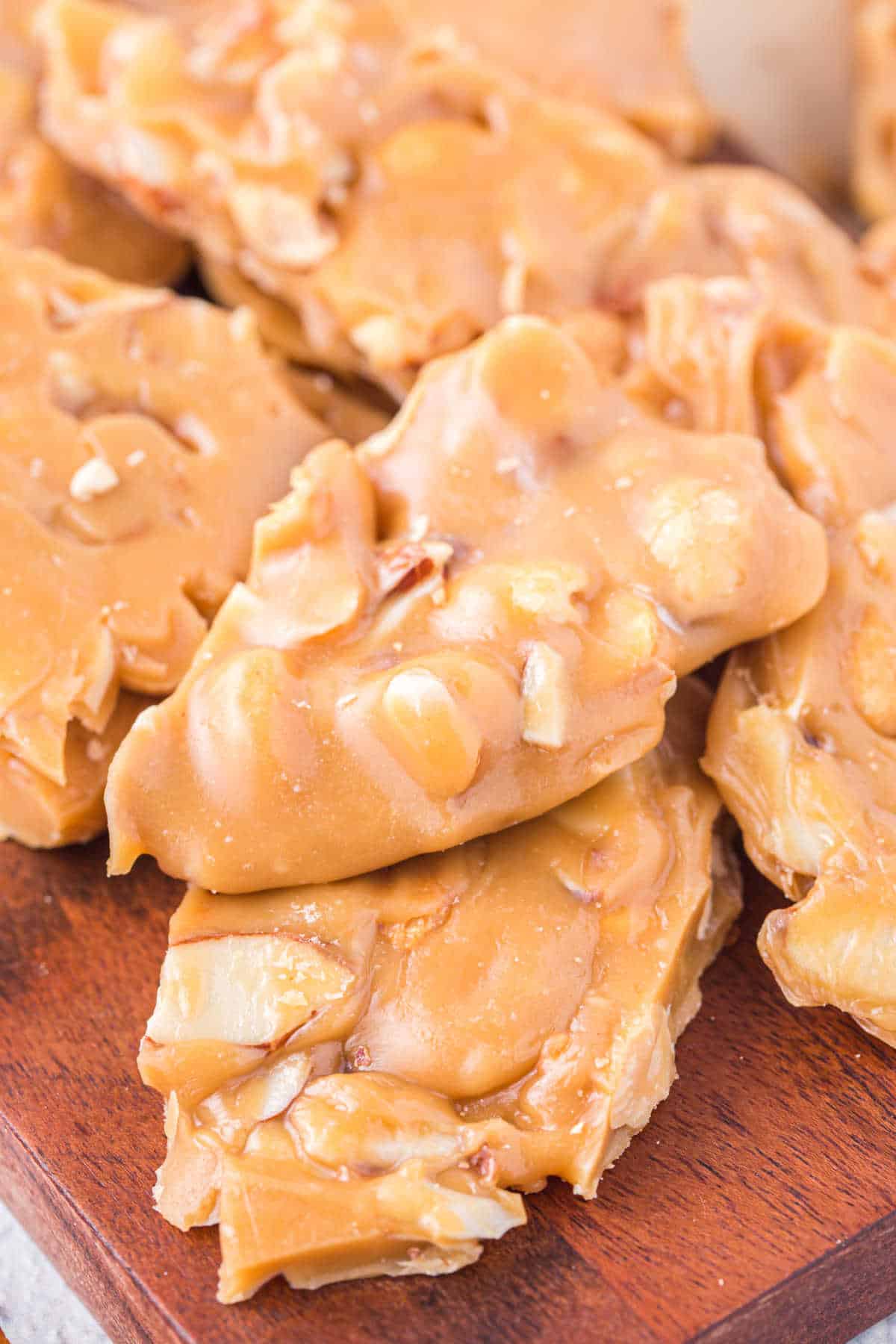 A group of caramel nut brittle pieces. 