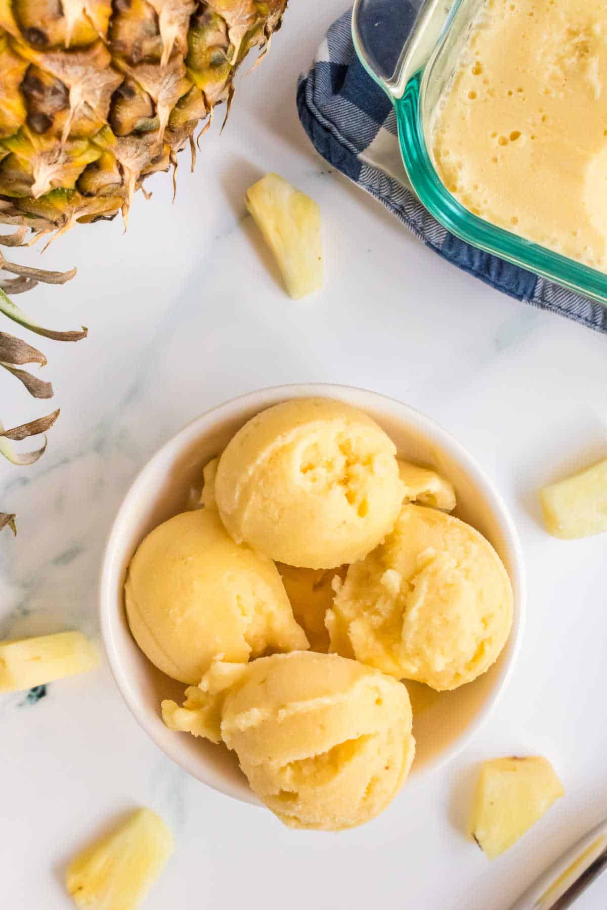 Pineapple ice cream in a bowl.