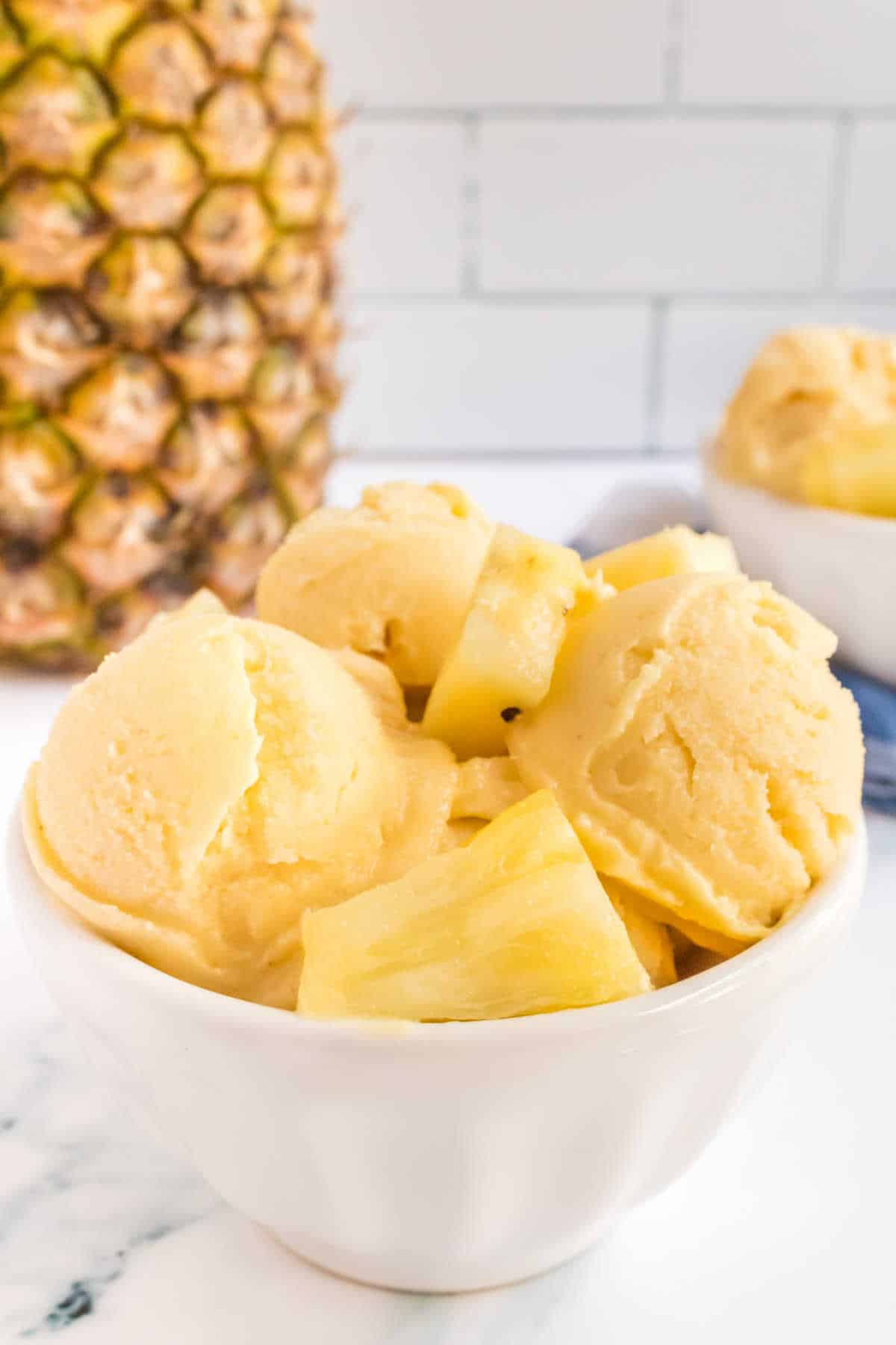 Pineapple ice cream in a bowl.