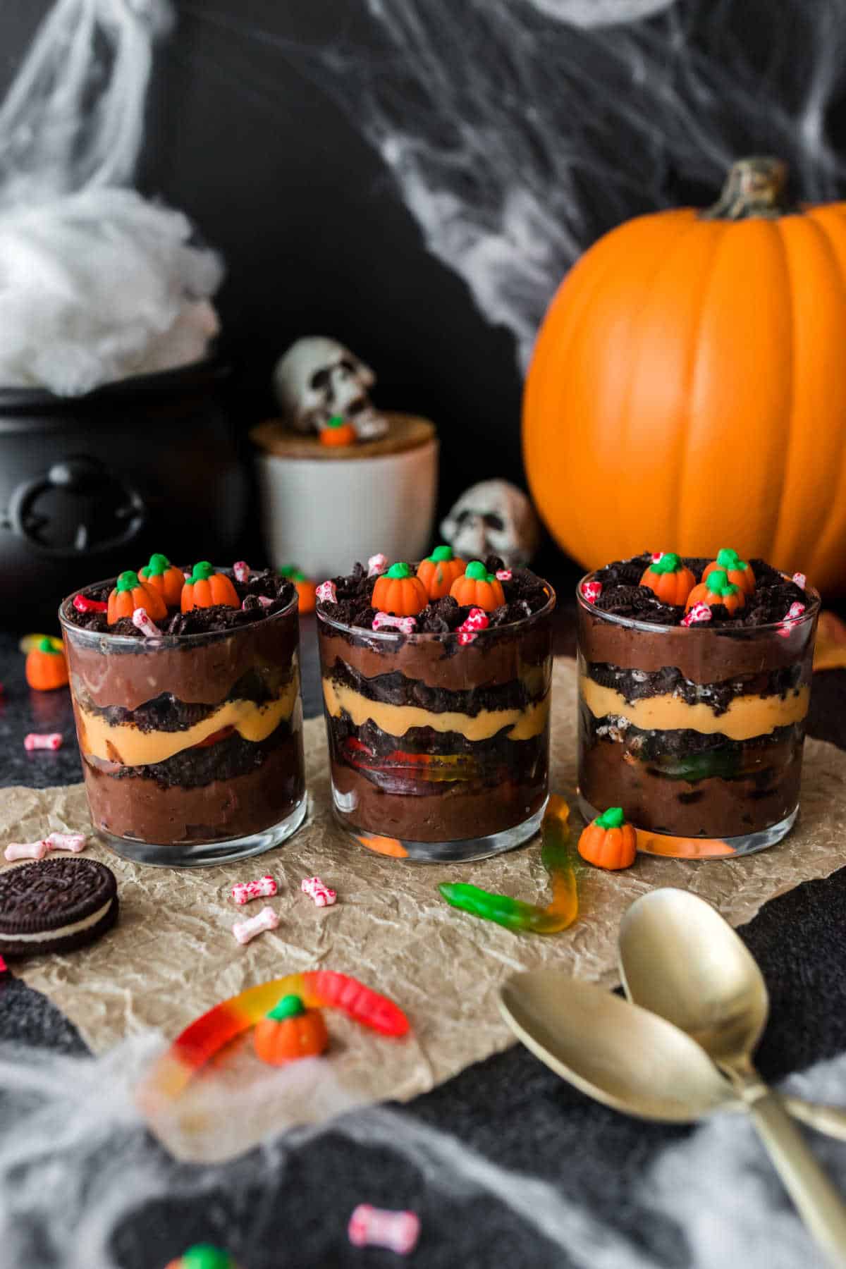 Three pumpkin patch dirt cups lined up in a row.
