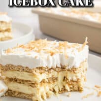 Coconut icebox cake with a bite out of it on a plate.