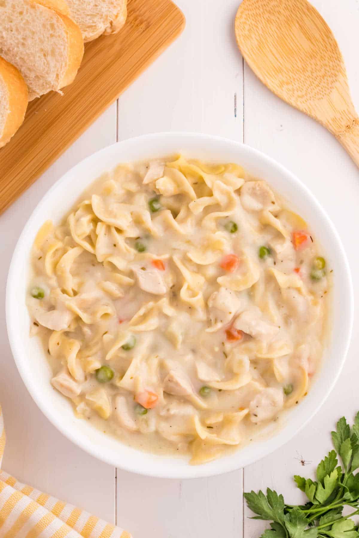 A bowl of creamy chicken noodle soup.