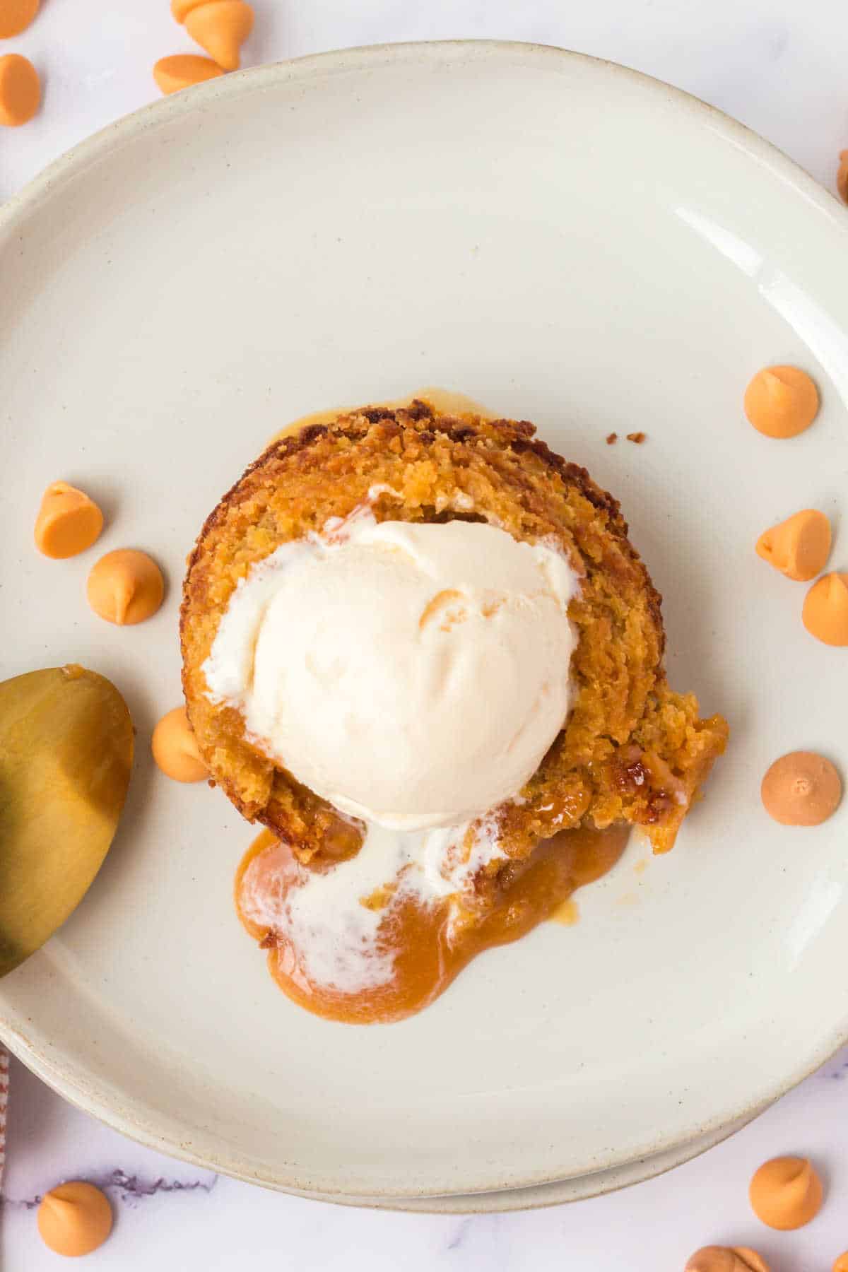 A butterscotch lava cake topped with vanilla ice cream.
