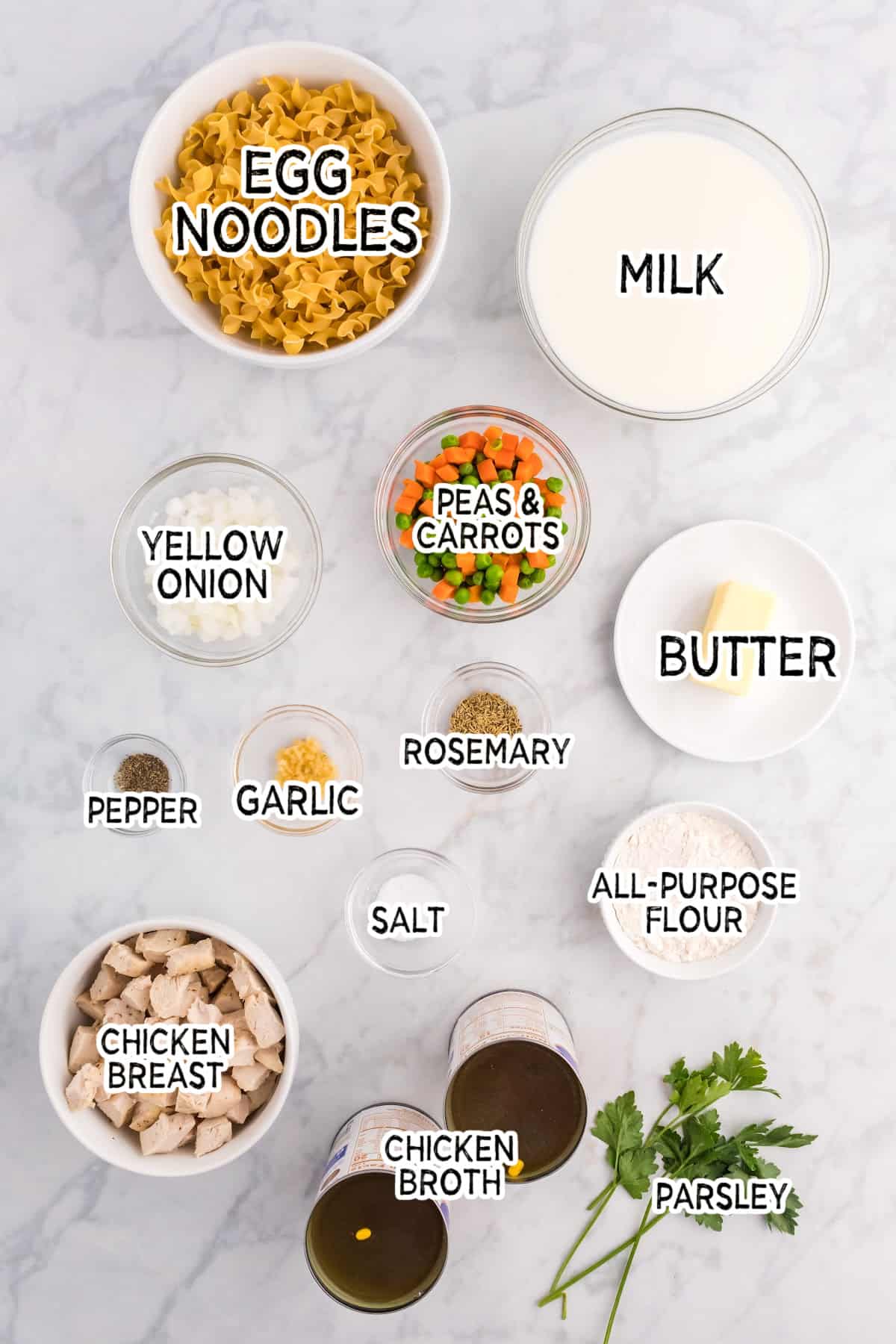 Ingredients to make creamy chicken noodle soup.