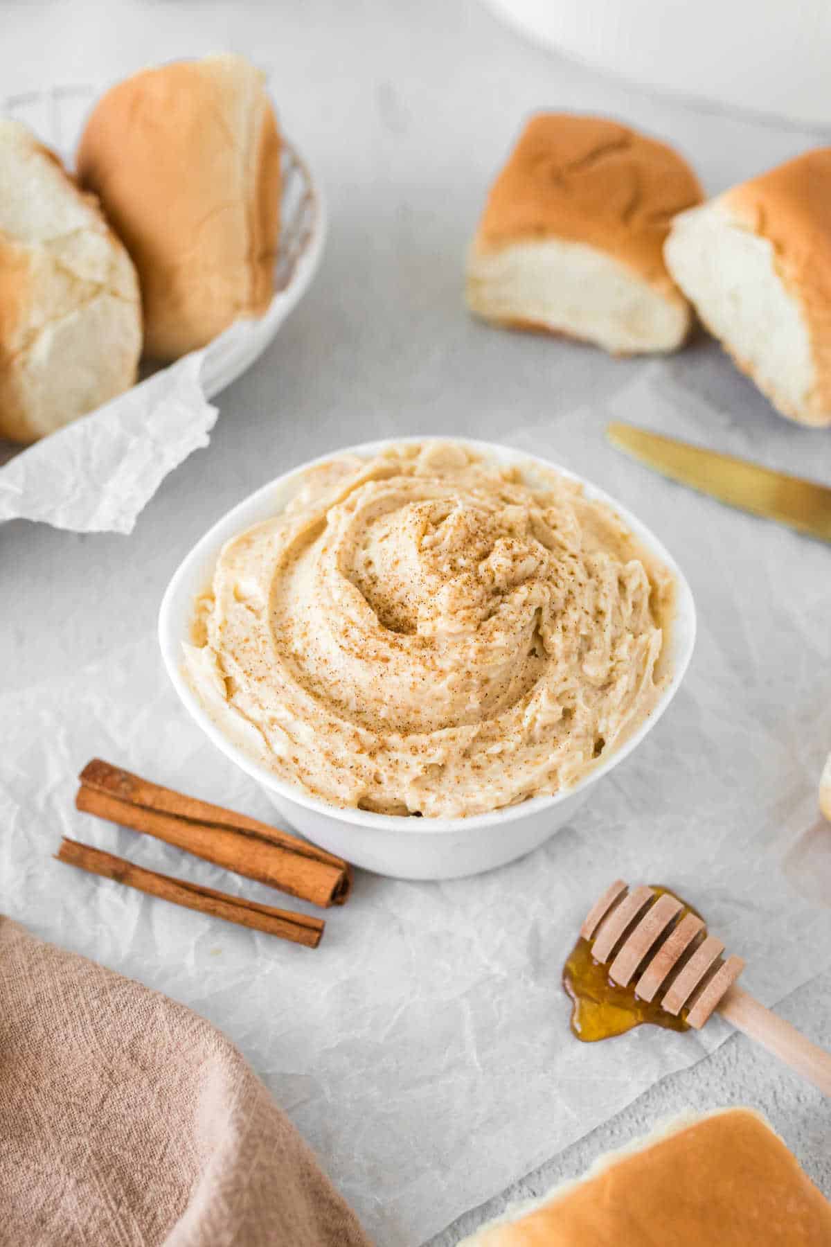 A bowl of the butter surrounded by ingredients.