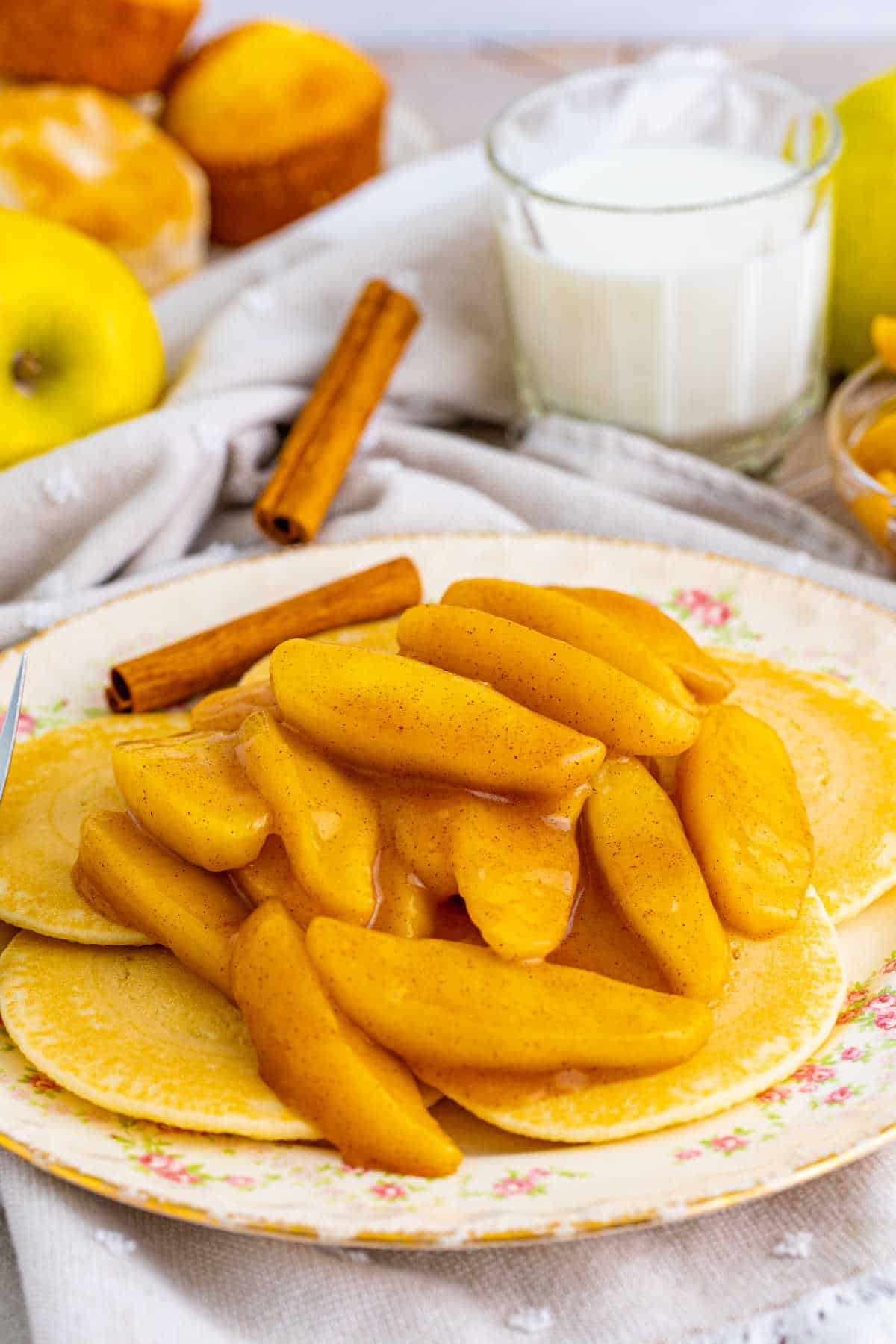 Fried apples served on top of pancakes.