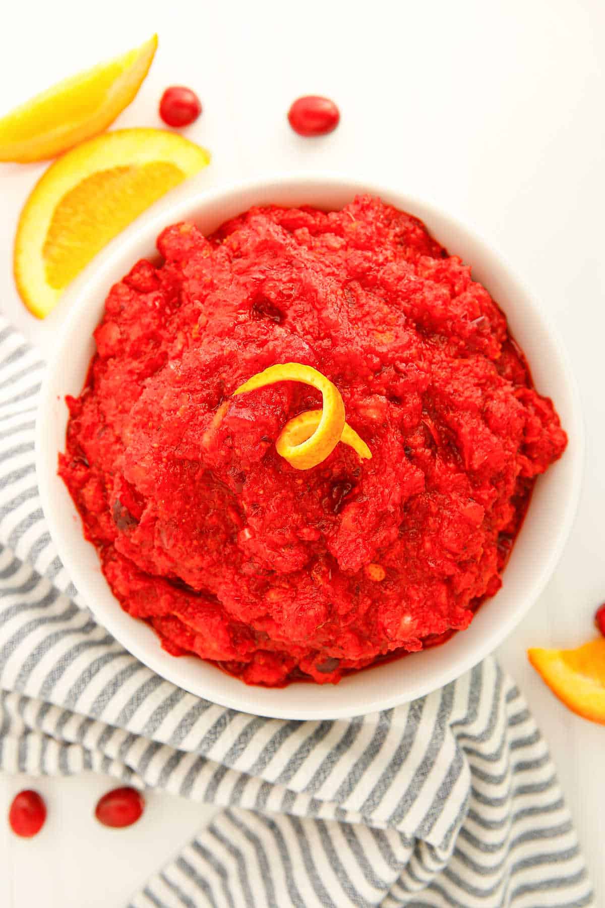 Cranberry relish in a white serving bowl.