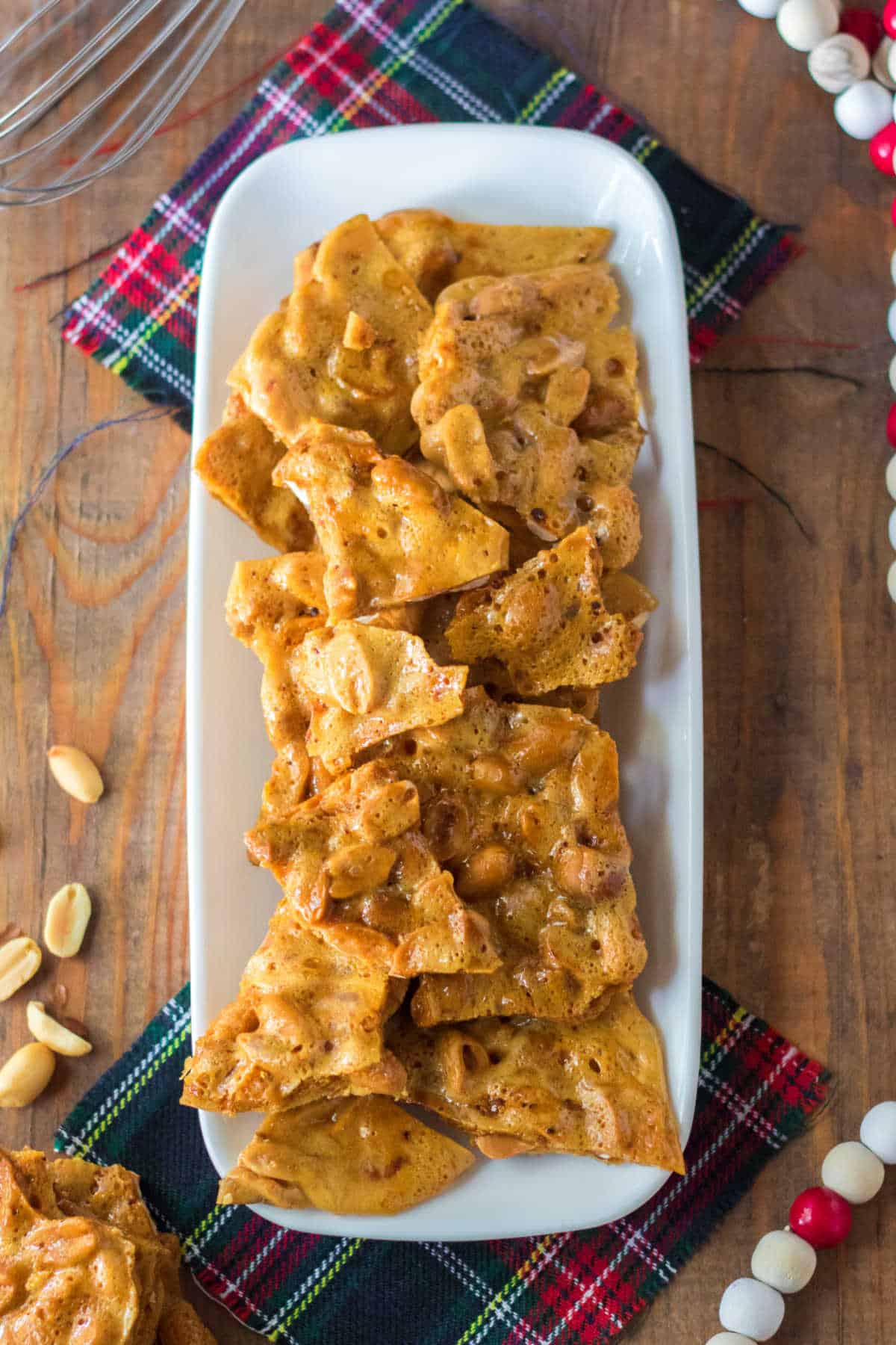 A white platter of microwave peanut brittle.